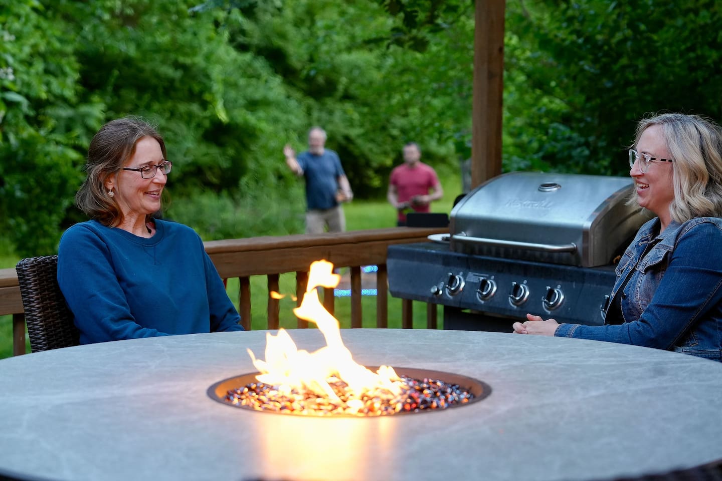 Chat around the table while the rest of your group plays yard games.