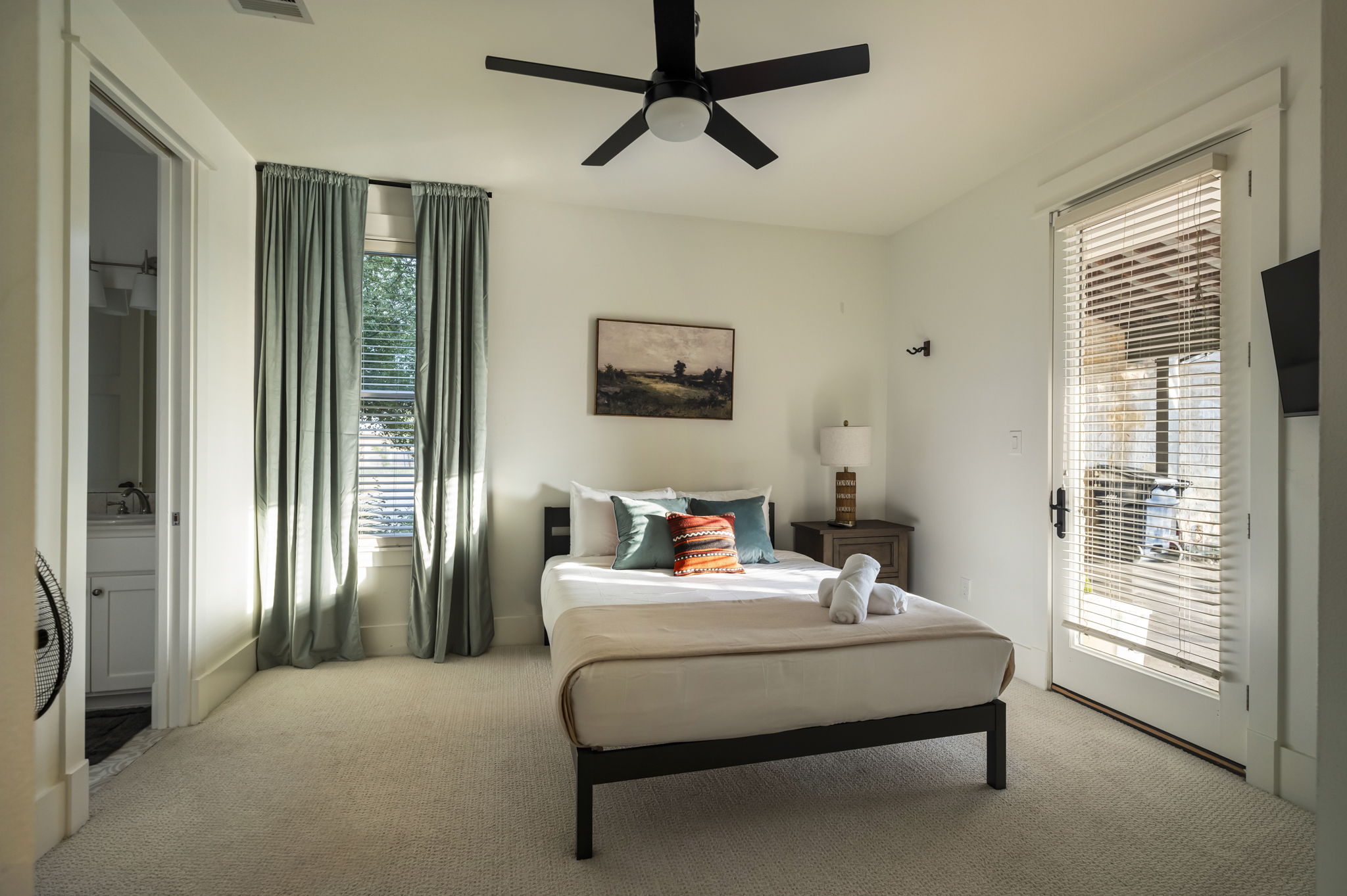 Relaxing guest room with direct access to the pool area and a Jack & Jill bathroom.