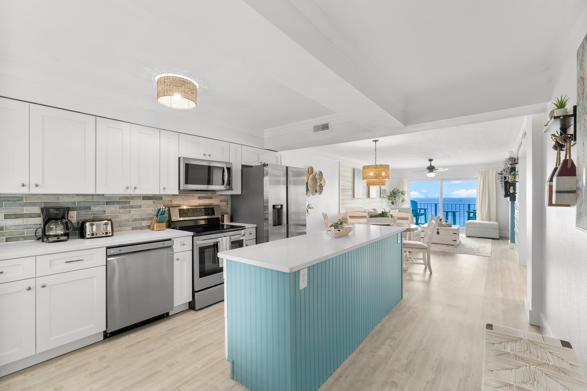 Whip up a delicious snack or a full meal in our bright, coastal kitchen while enjoying an open view to the ocean! Let the natural light dance on your countertops as you explore your culinary creativity amidst the soothing backdrop of crashing waves.