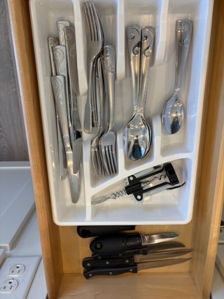 Fully stocked kitchen utensils and flatware
