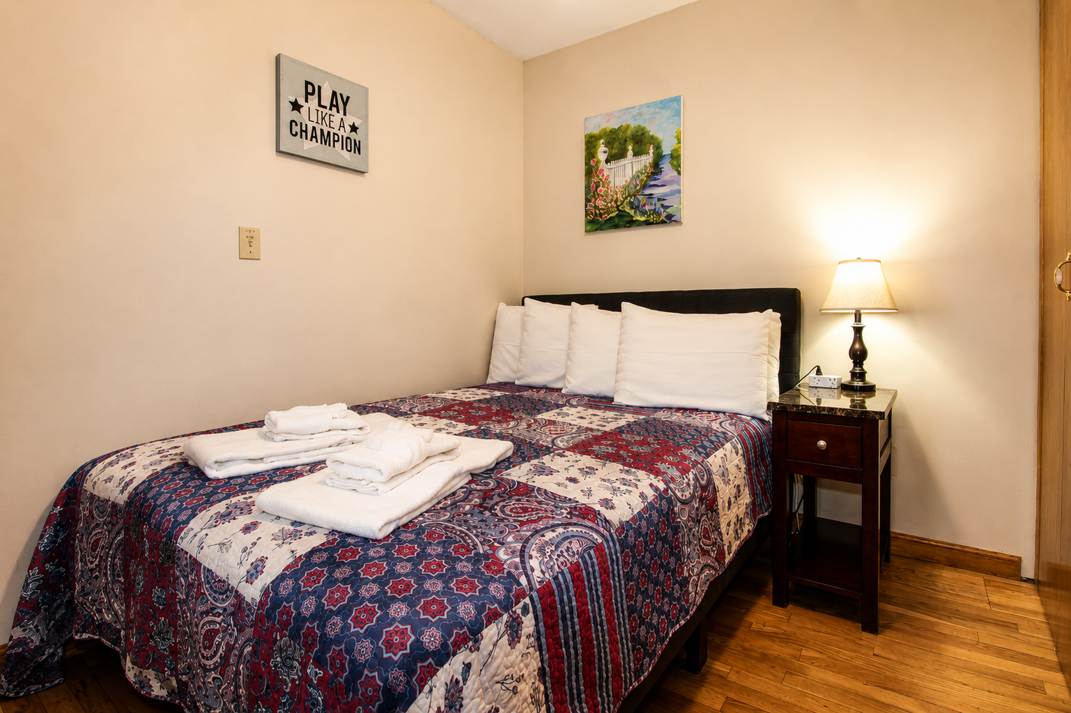 Bedroom #4 with a full bed, located on the first floor off the living room.