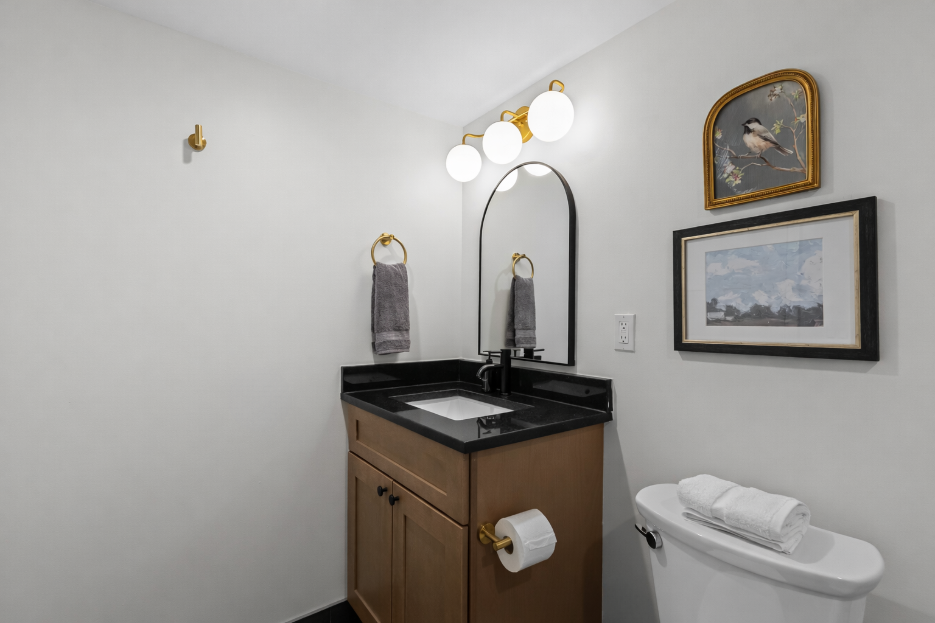 Fresh, modern bathroom with sleek vanity, soft lighting, clean finishes, and plush towels—bright, simple, and thoughtfully designed.