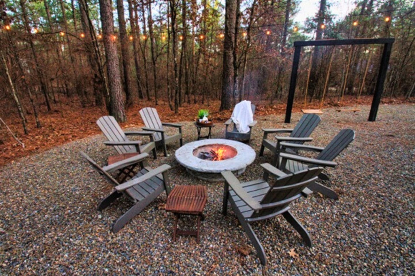 Gather around the fire pit for cozy evenings under the stars, complete with Adirondack chairs for relaxing and roasting s’mores.