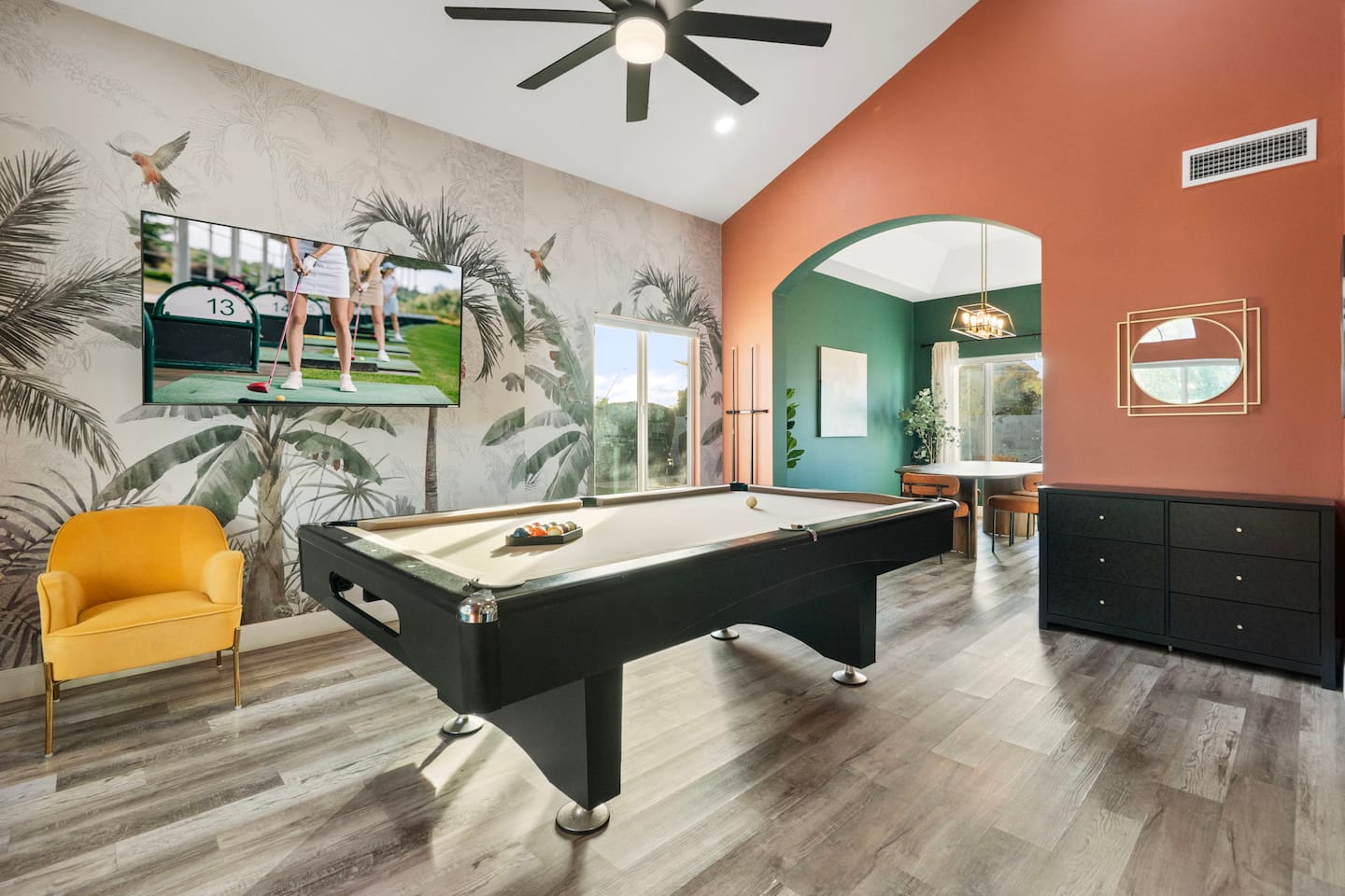 Game room with pool table, golf simulator, and entertainment lounge—the ultimate hangout space.