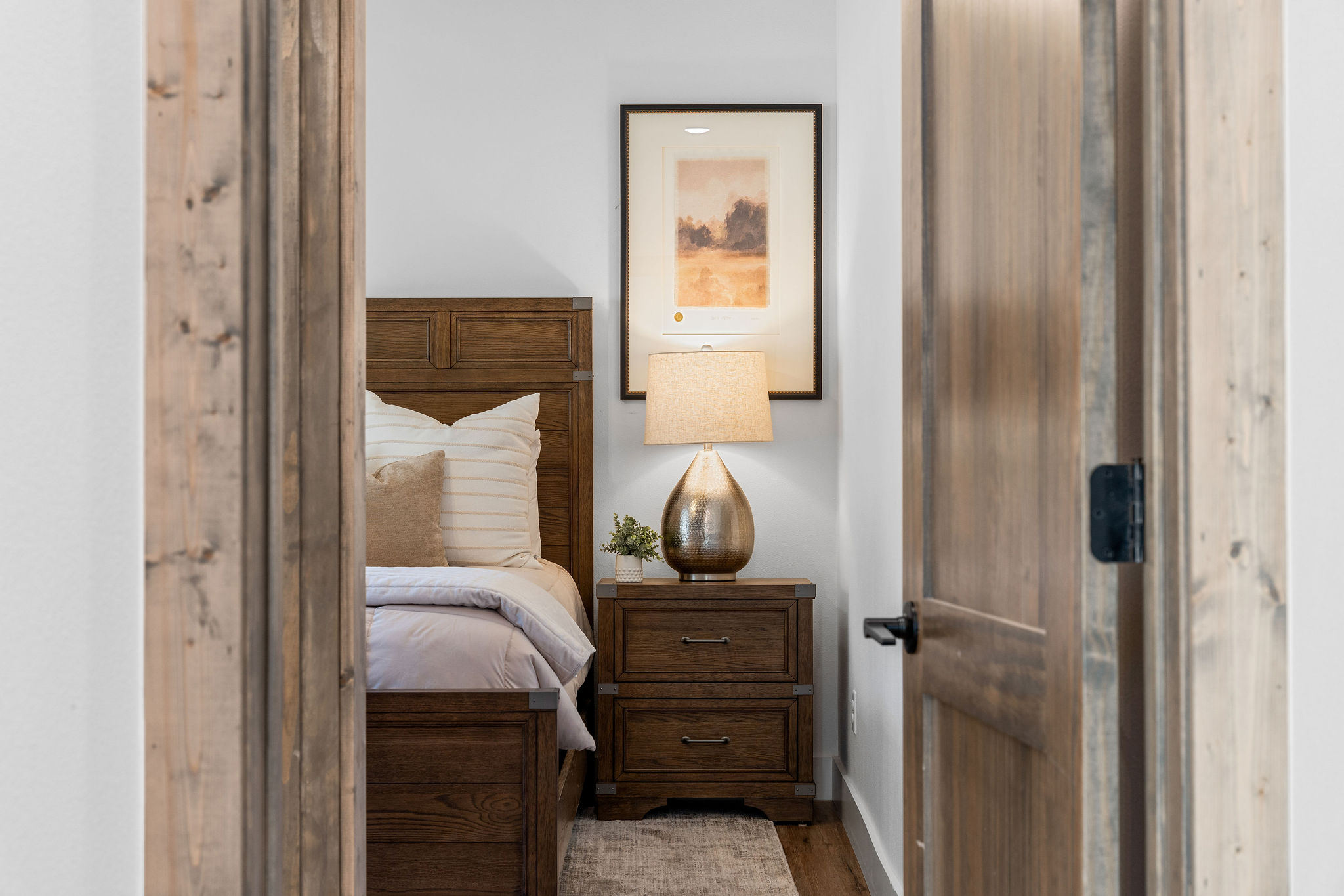 Stylish king bedroom on the main floor offering privacy and a peaceful place to recharge.