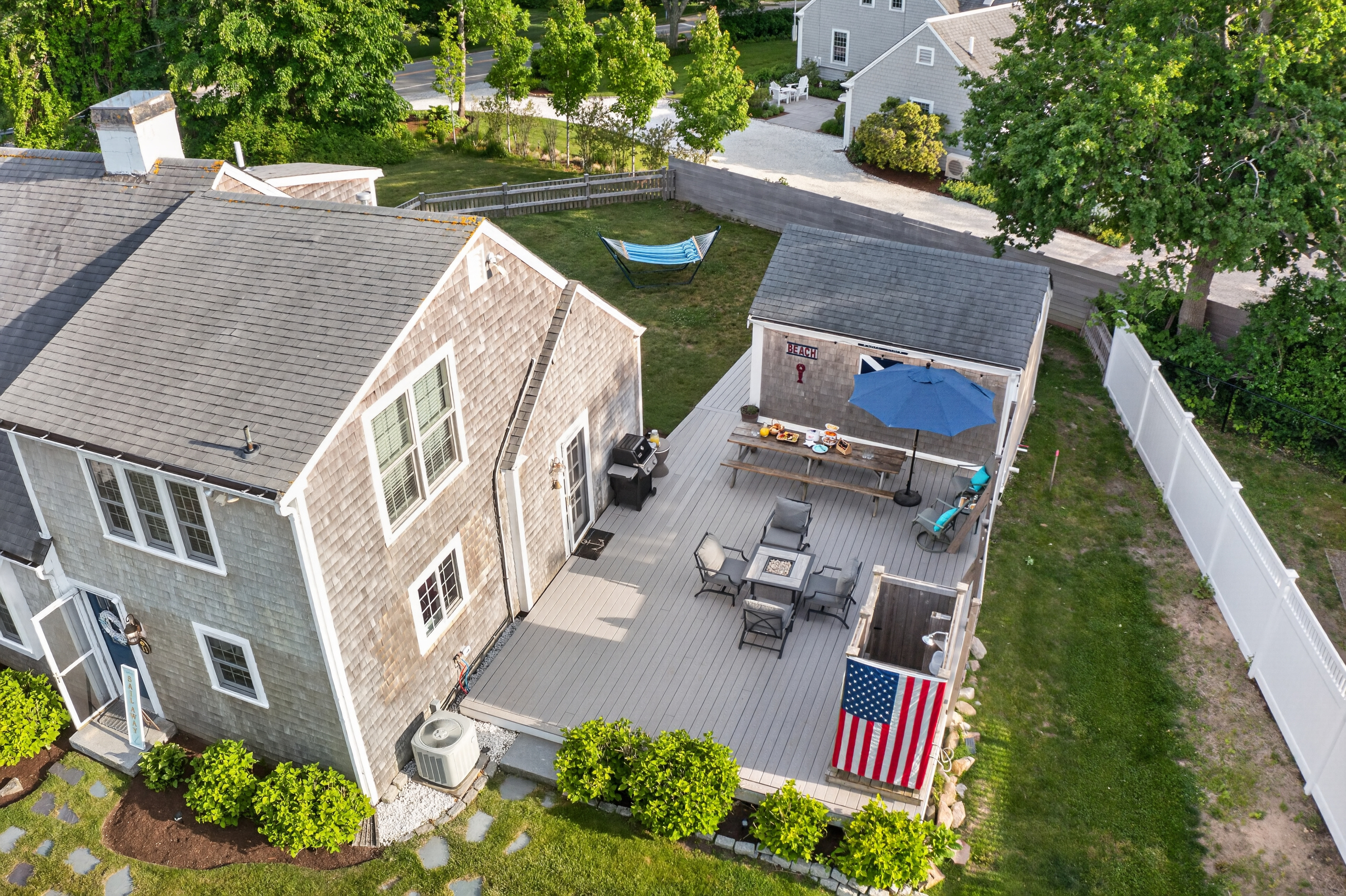 Bird's-eye view of the home featuring a large backyard and inviting outdoor living space.