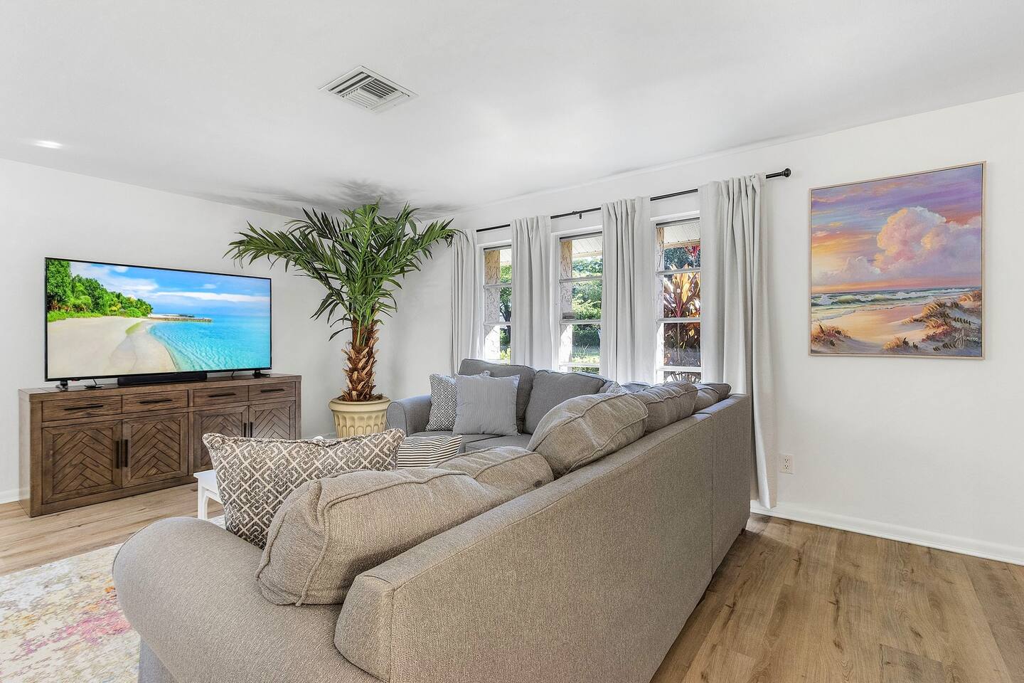 Enjoy a comfortable living space with cozy seating and plush pillows—perfect for movie nights and relaxation!