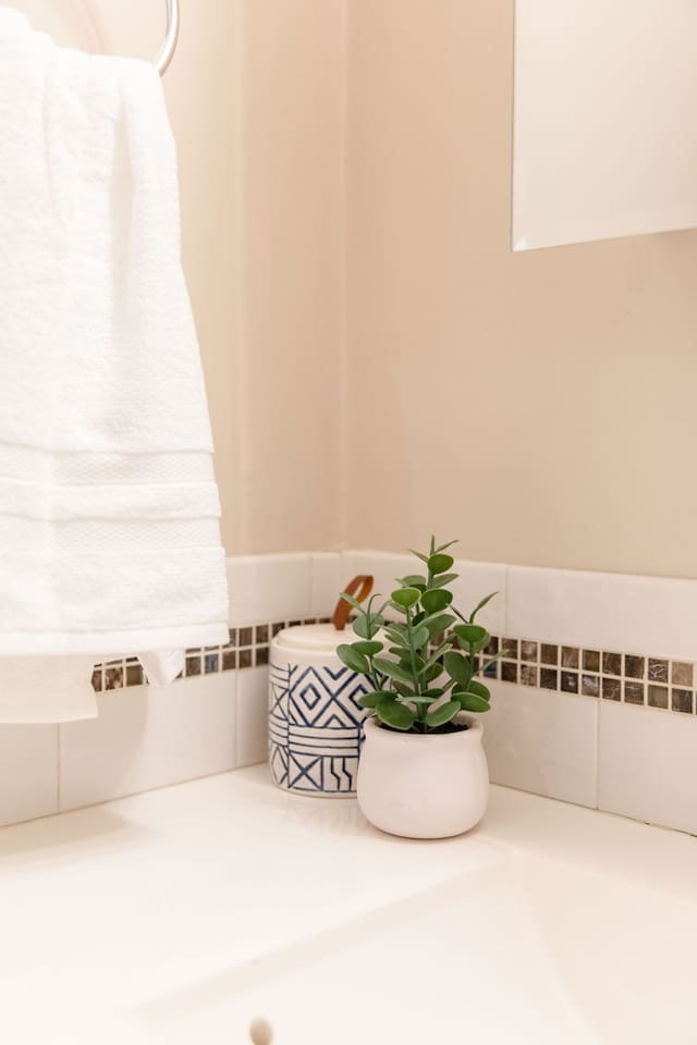 Fully equipped bathroom with a shower, sink, toilet, and all the essentials you need for a comfortable stay.