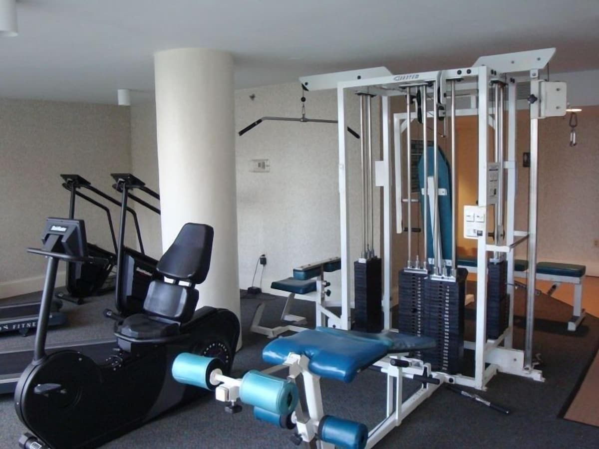Exercise facility located directly next to indoor pool area