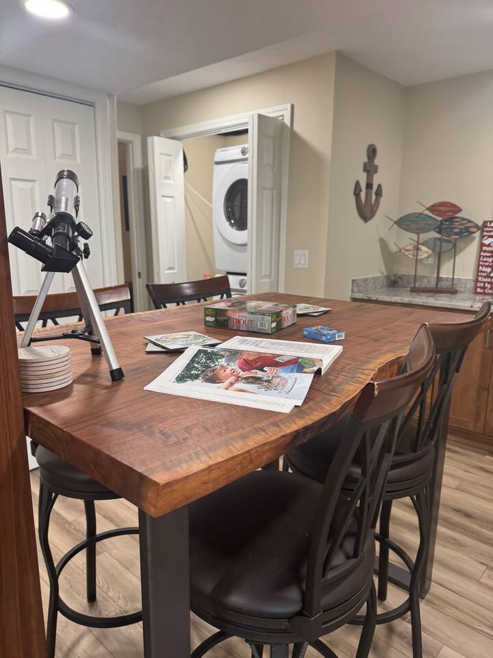 Lower level  live edge top / bar chairs