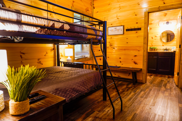 Lower level Full bedroom with attached bathroom. Indoor heated pool is on this level just behind a locked door.