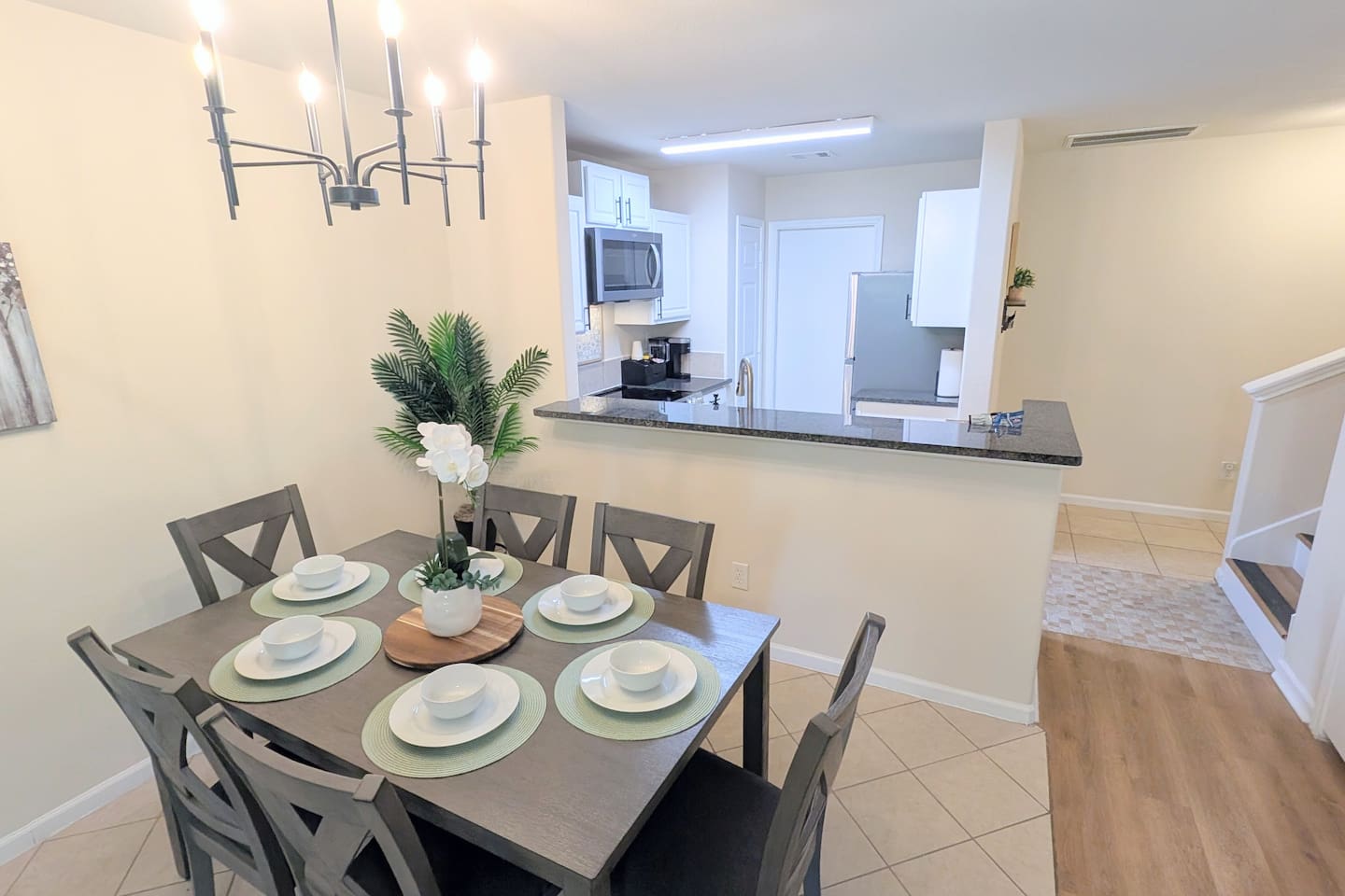 Dining room is located off the kitchen in this open concept living space. 