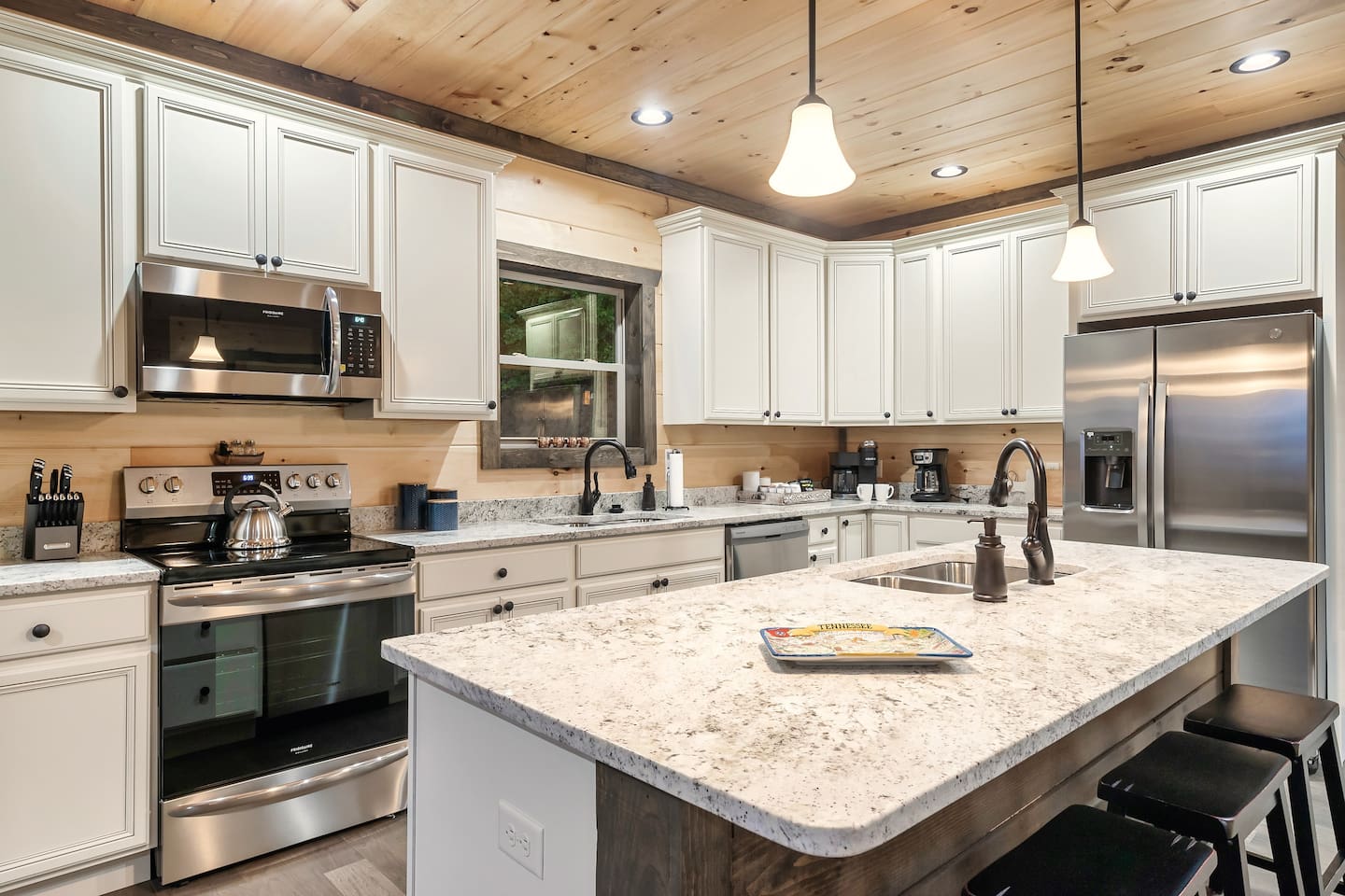 A dream kitchen for entertaining!  Two sinks, two refrigerators and two dishwashers!  