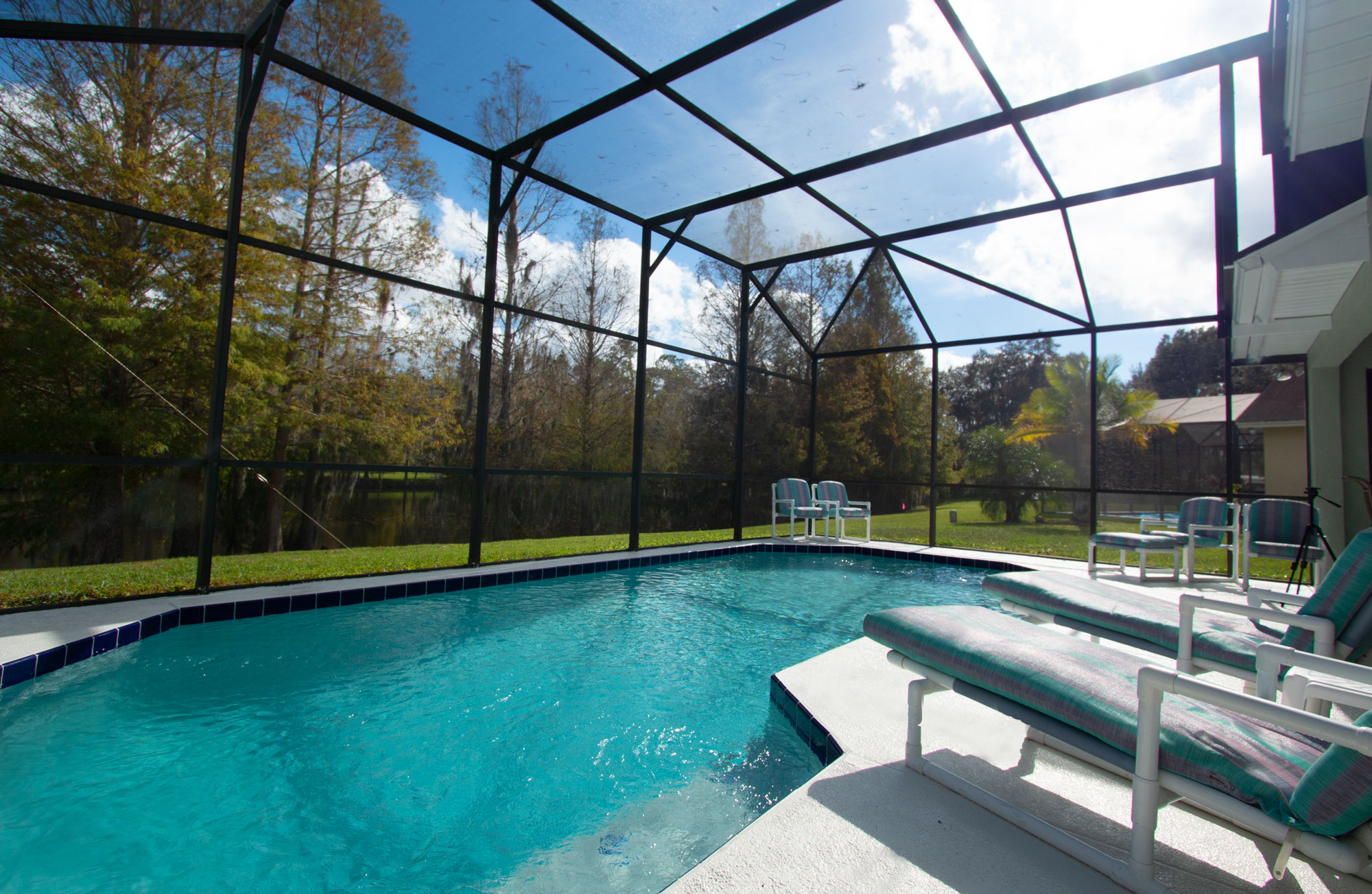 Relax by your Private Screened Pool with a gorgeous view of the lake!