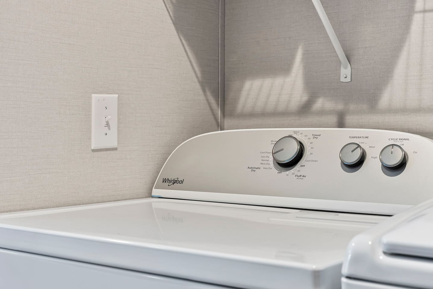 Spacious dryer and laundry space with everything you need to keep clothes fresh during your stay.