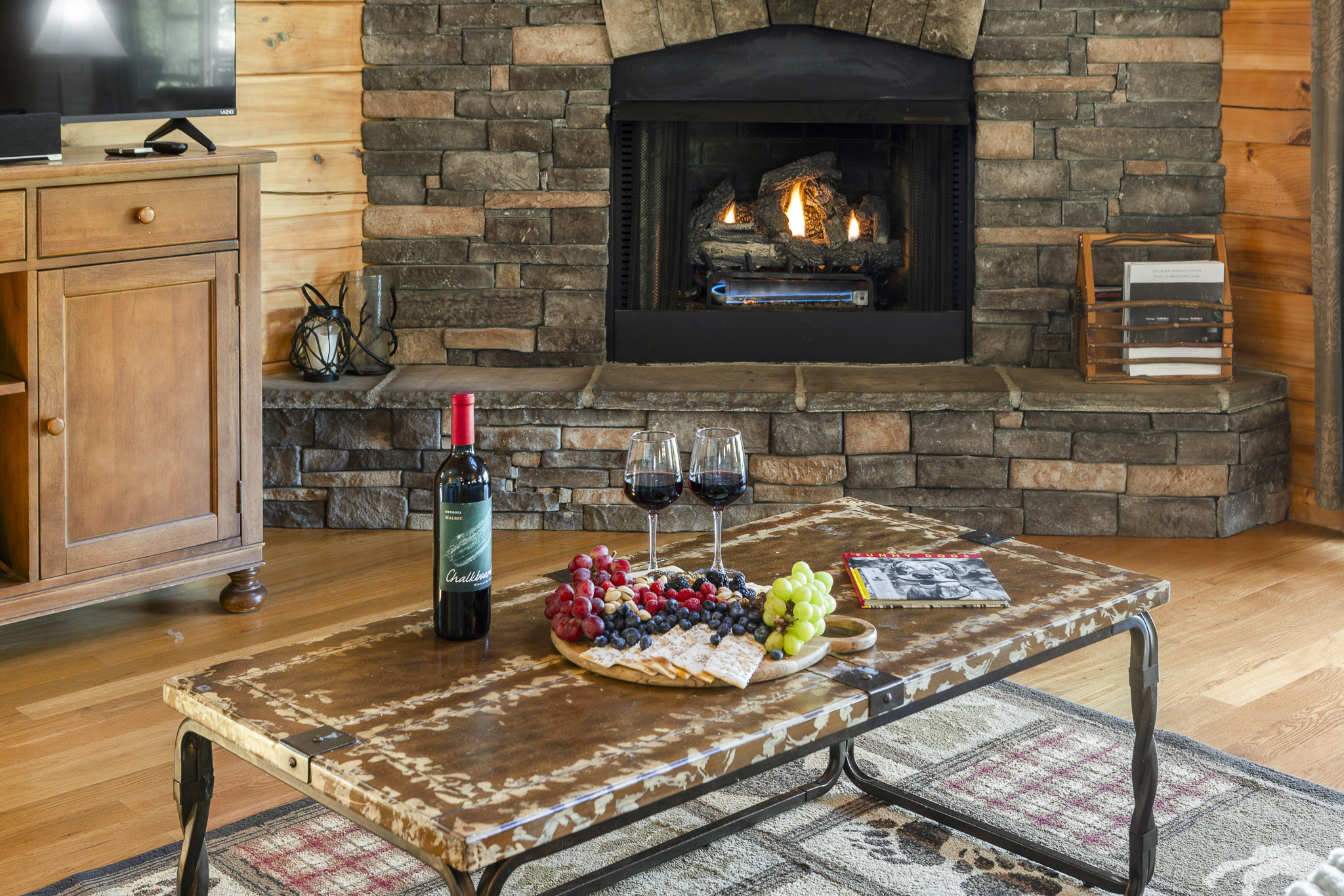 Living Room: Gather around the fireplace with wine, snacks, and timeless mountain charm!