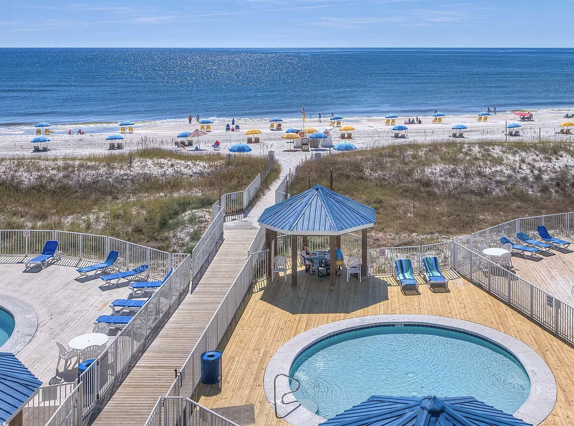View of Beach from shared space Veranda of Complex