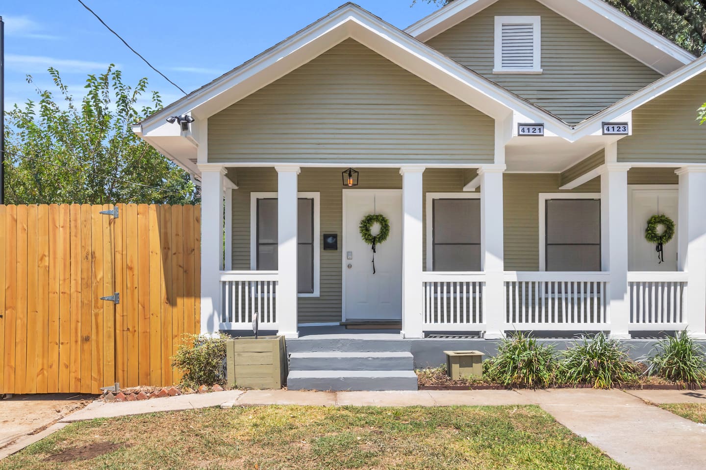 Start your day on the covered porch surrounded by peaceful neighborhood vibes — an ideal spot to sip coffee, plan adventures, or unwind after exploring the city.