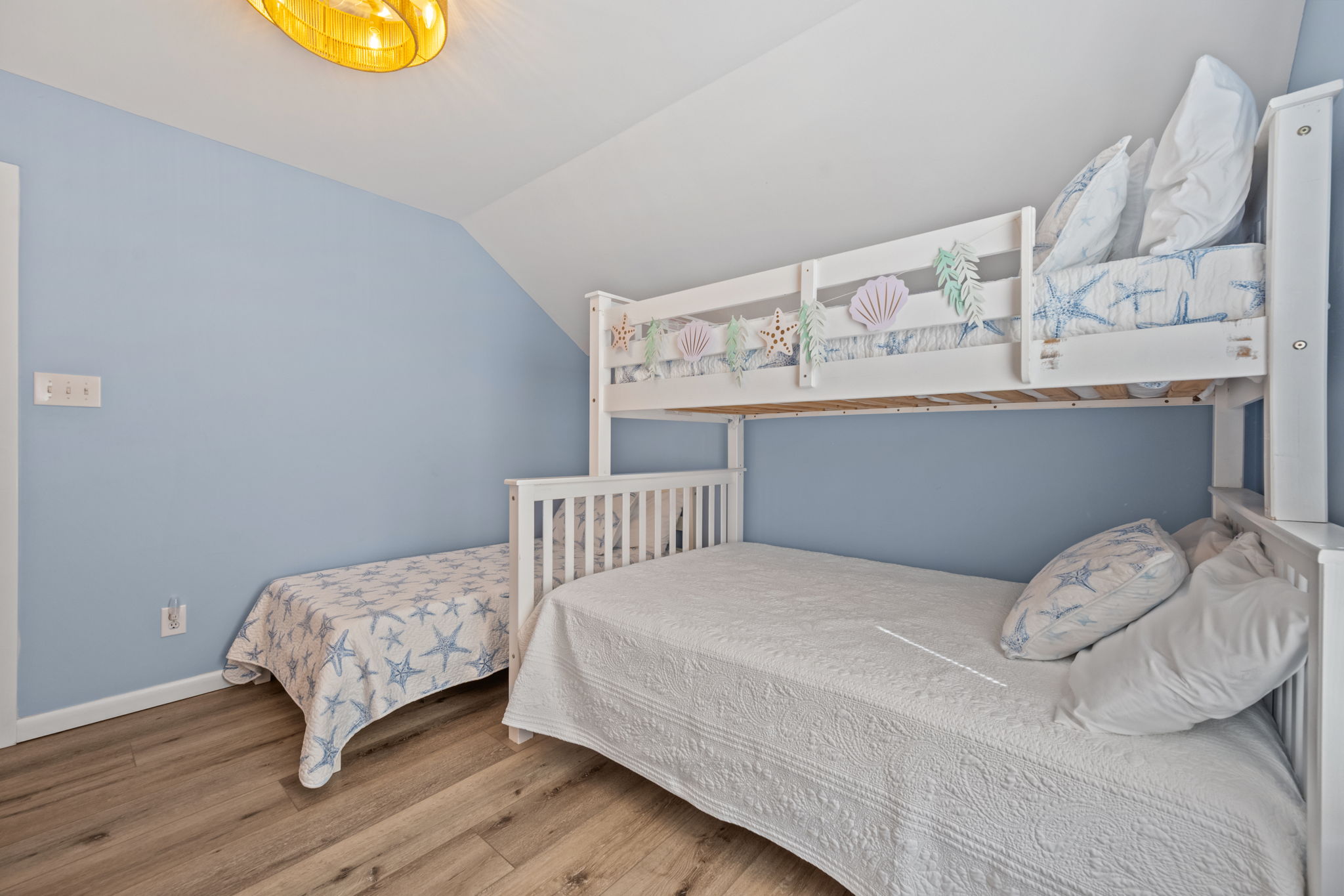 Adventure awaits in this cheerful bunk room!