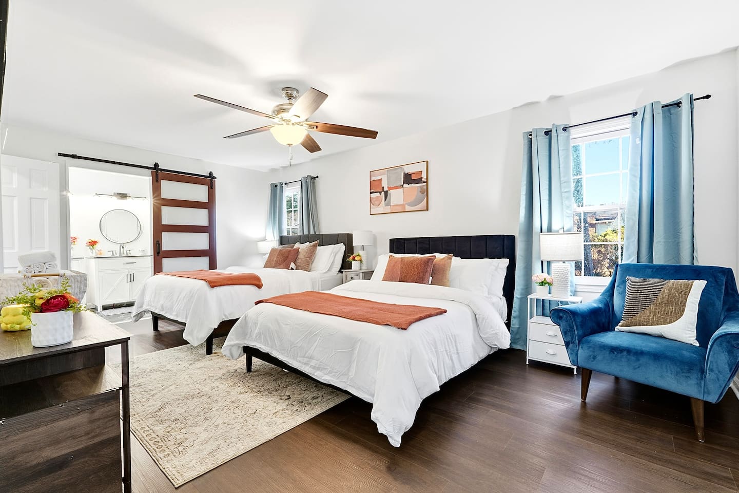 Located furthest to the left at the top of the stairs, this warm and inviting bedroom features two double beds, a smart TV, and a private en-suite master bathroom. This room includes 4 full-body towels, 4 washcloths, and 2 hand towels for your stay.
