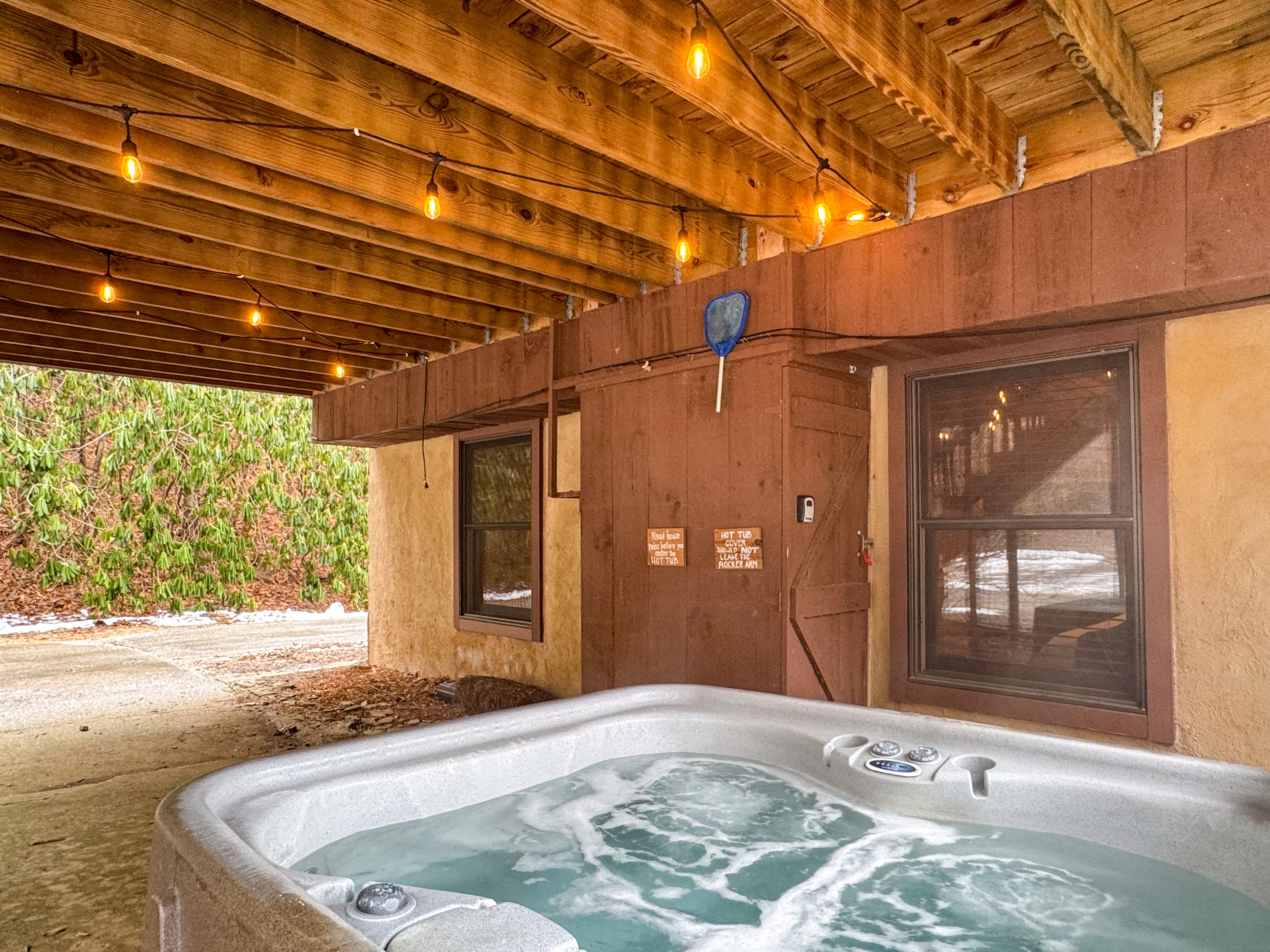 hot tub area under the covered deck overlooking the courtyard.