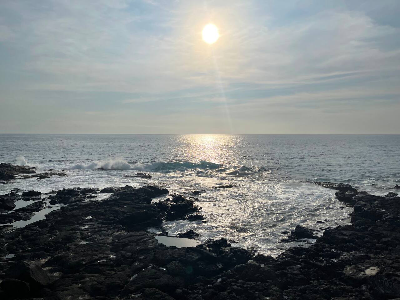 Dramatic Kona coastline just steps away — enjoy stunning sunsets and the soothing sound of the waves.