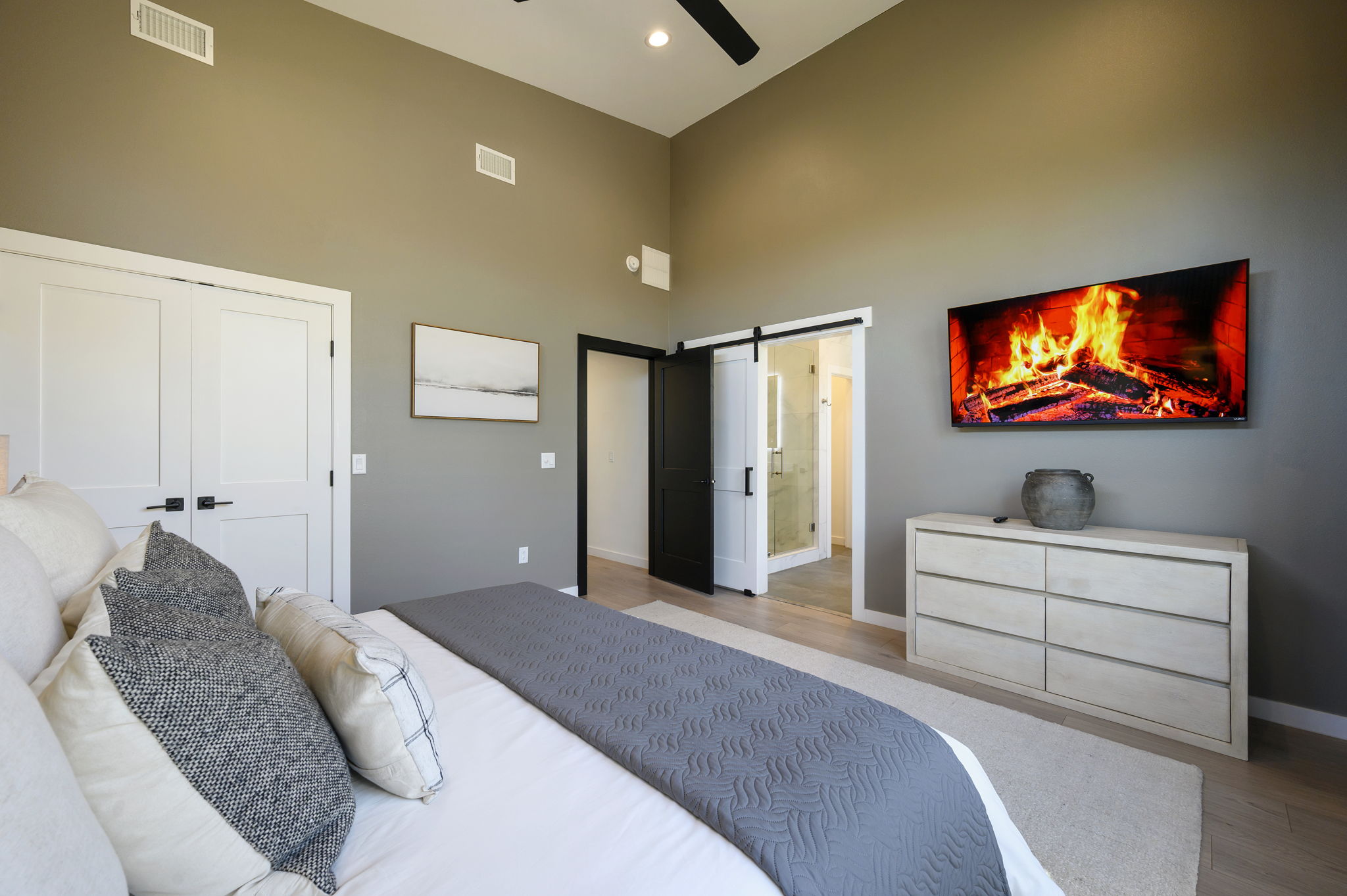 King Suite 2 - Large and spacious suite with teak wood paneling, designer finishes, smart TV, premium king mattress, and luxury bedding. Includes stunning views of the hardwood forest. 
