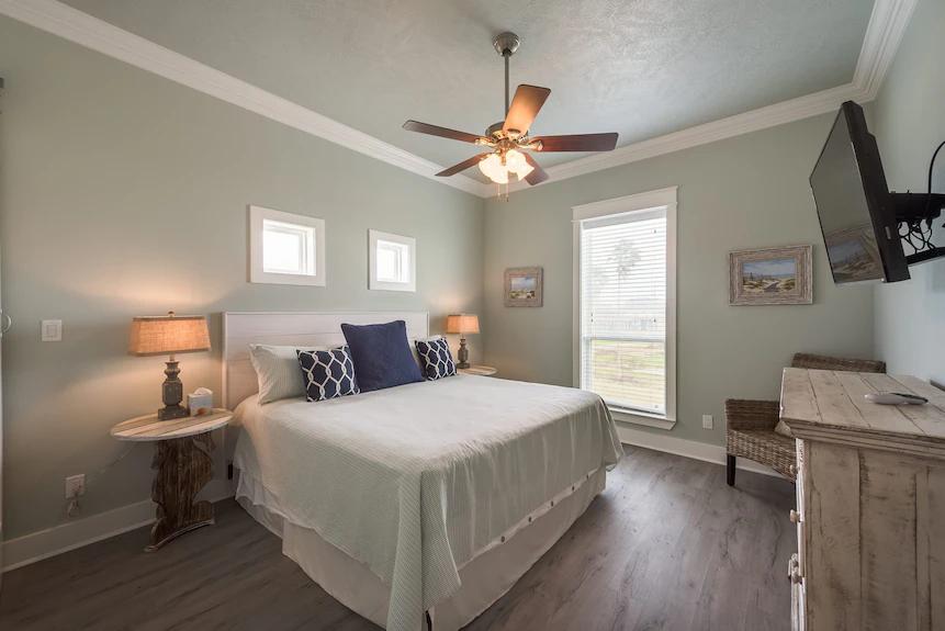 Breezy Point Bedroom 2: Featuring a comfortable king-size bed, designed for a relaxing and restful stay.