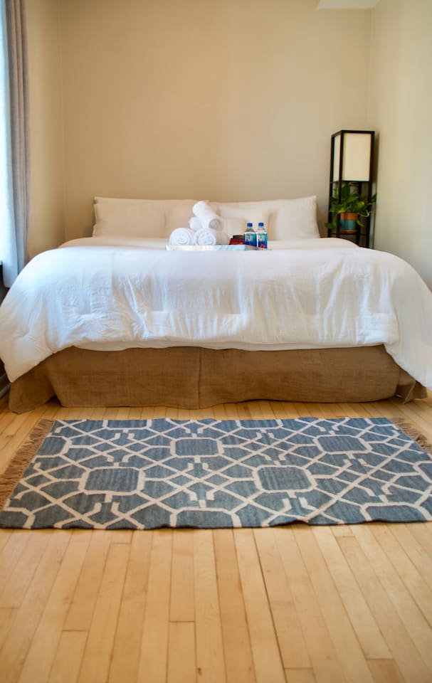 Bedroom with comfortable bed and soft linens for a peaceful night's sleep.