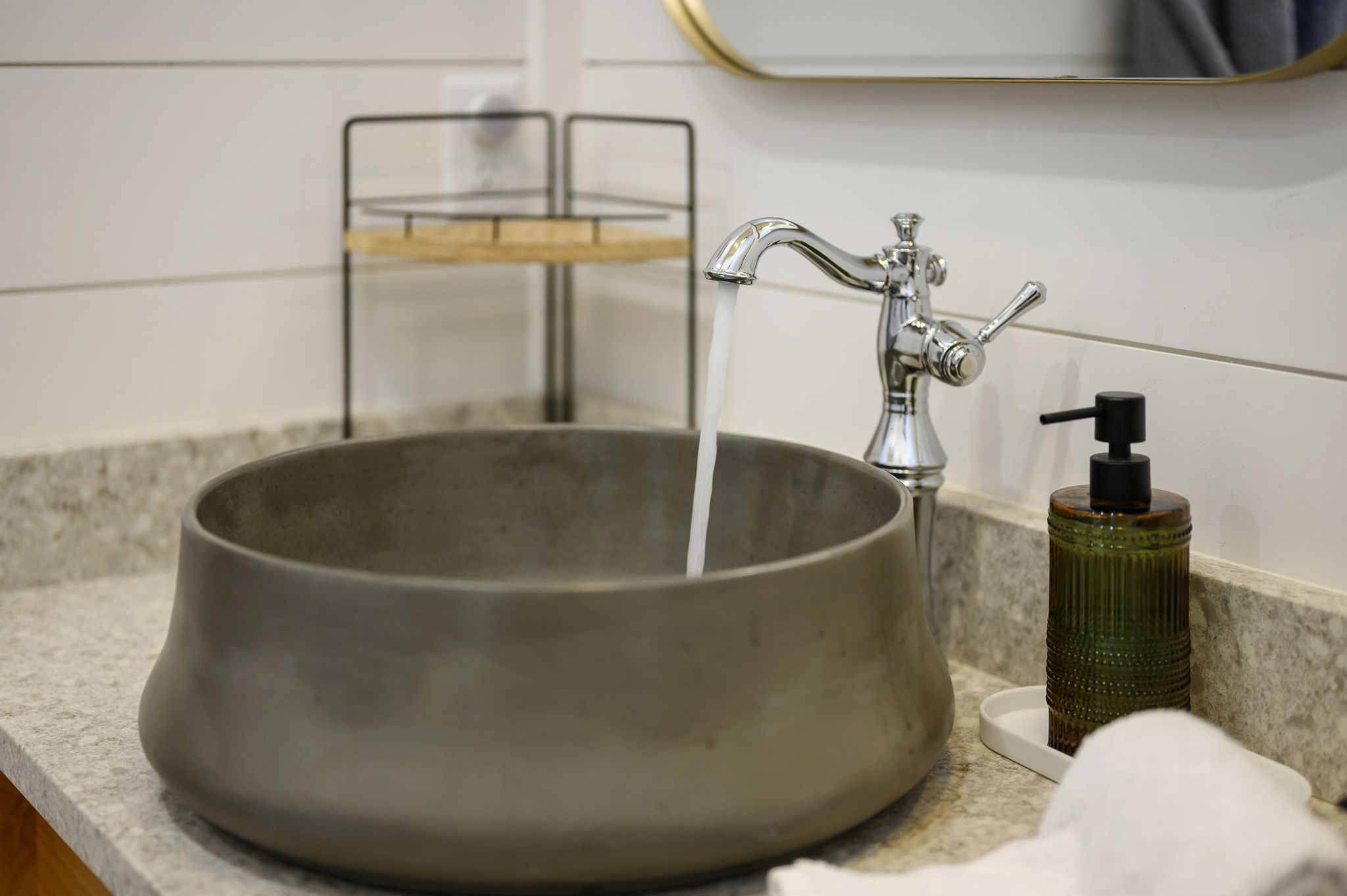 The primary ensuite bathroom offers a warm, spa-like experience with high-end finishes, luxurious touches, and a serene atmosphere designed for comfort and relaxation.