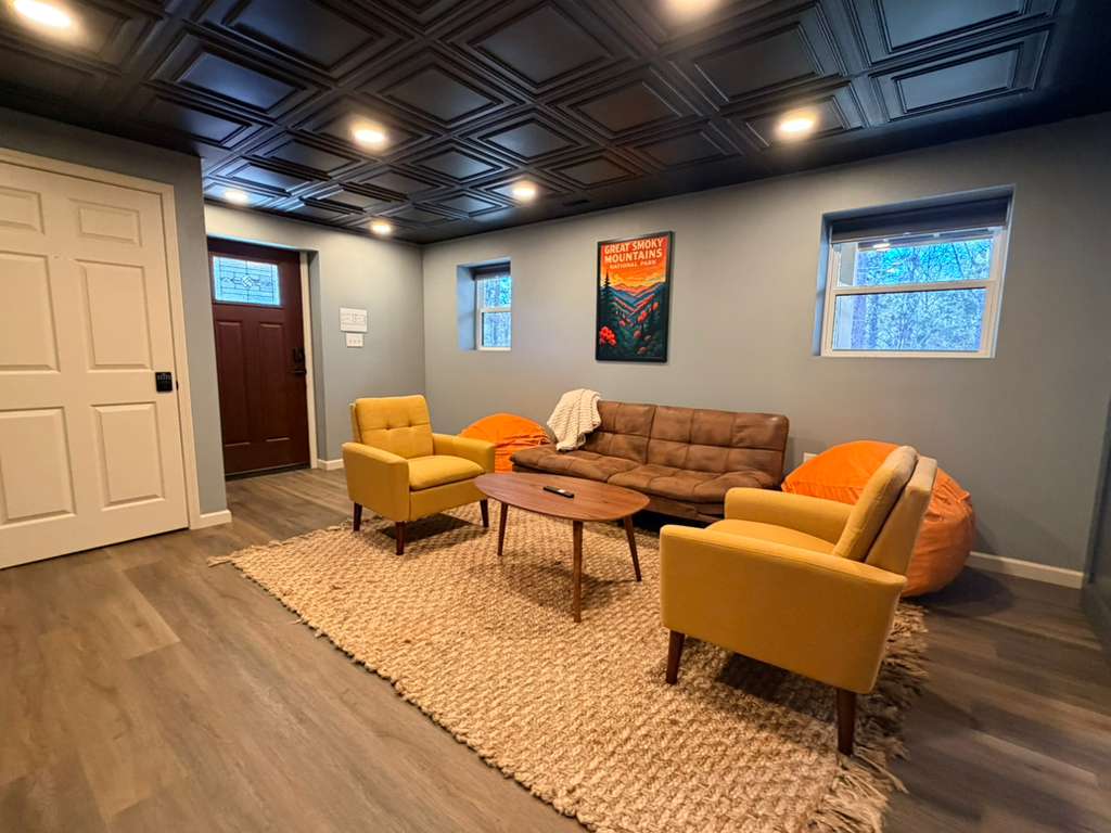 We love the details! The vintage-inspired poster and the dark wood flooring create a sophisticated, yet fun, mountain retreat vibe.