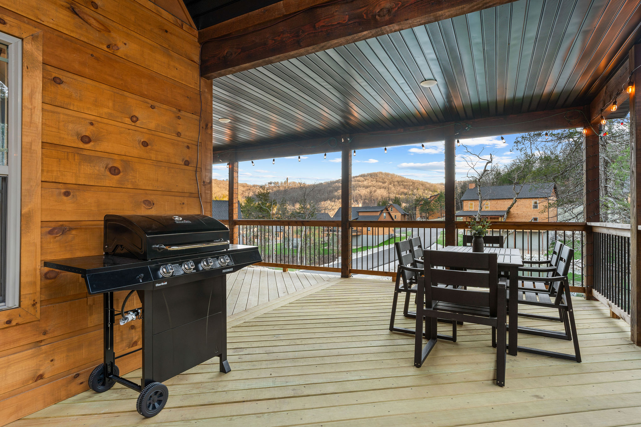 Grill and seating area set up for casual outdoor meals.