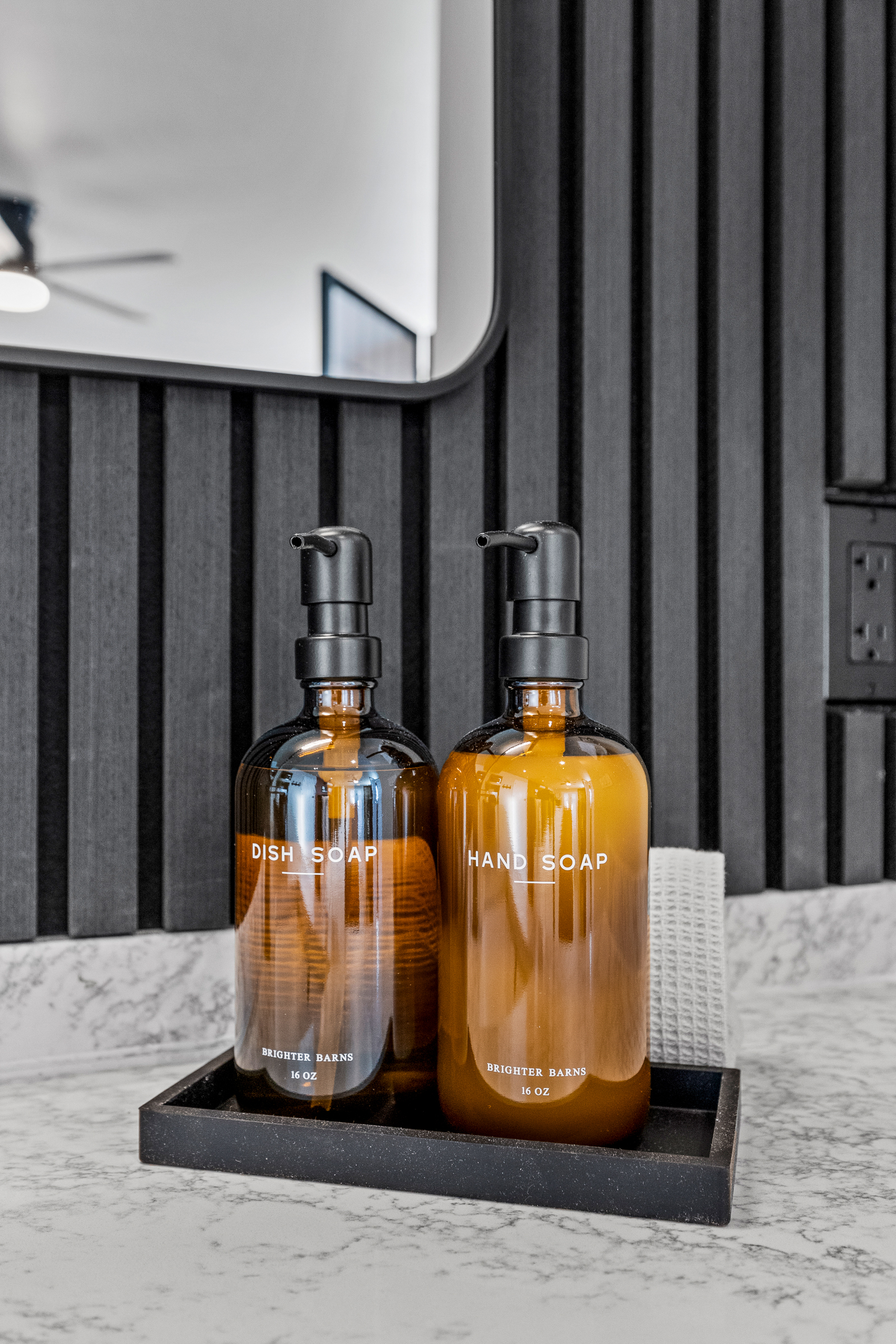 Thoughtfully stocked guesthouse bathroom with quality hand soap and essentials for a comfortable, hotel-style stay.