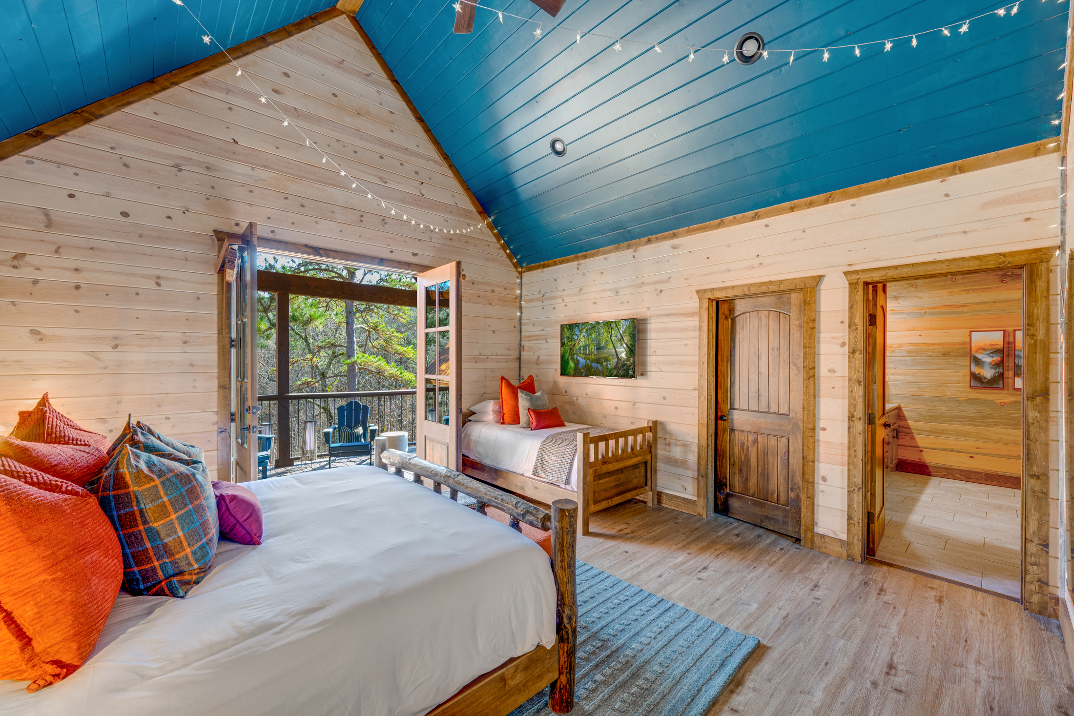 Charming Bedroom Retreat: Experience vibrant decor and serene balcony views for ultimate relaxation!