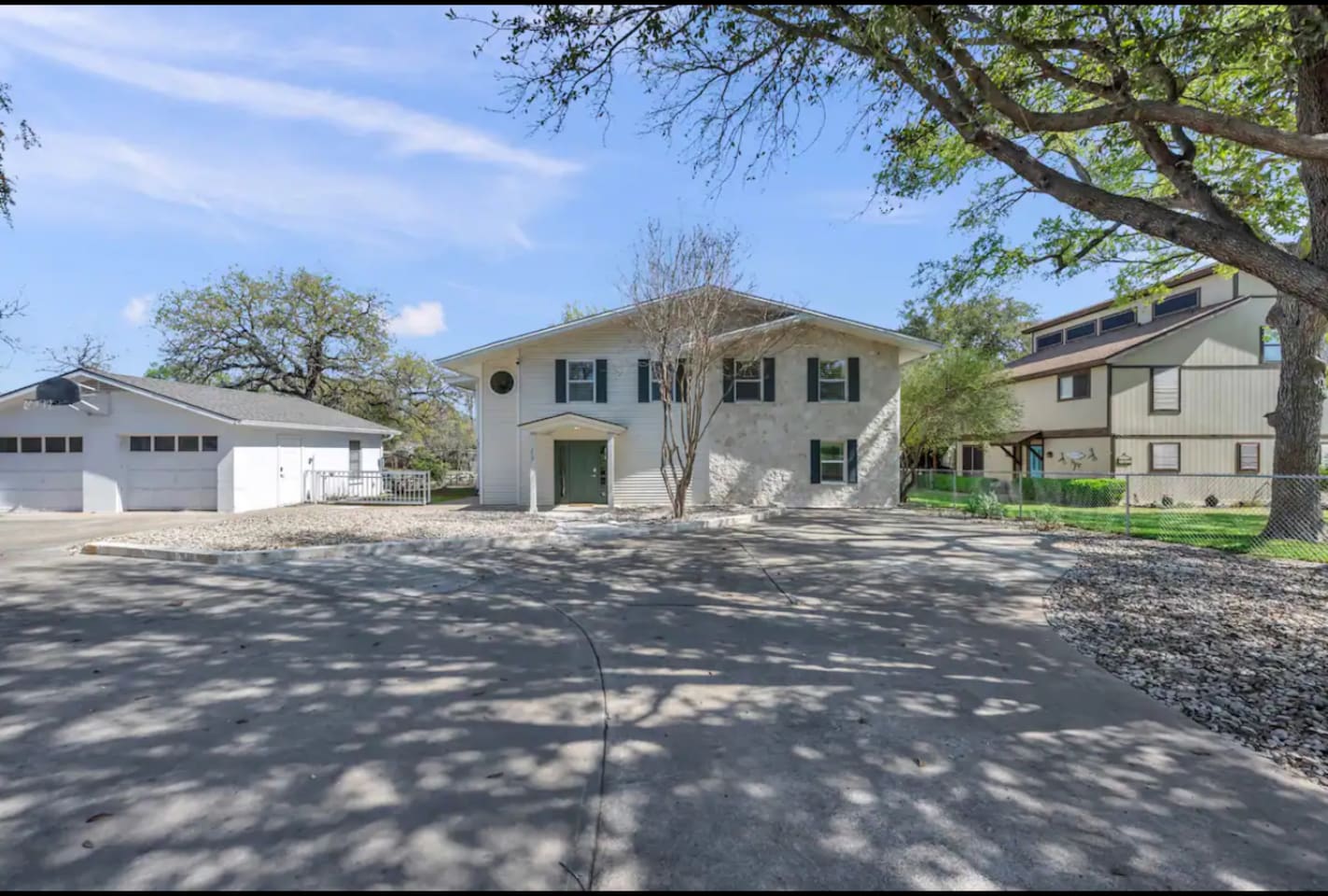 Street view of house showing al the parking