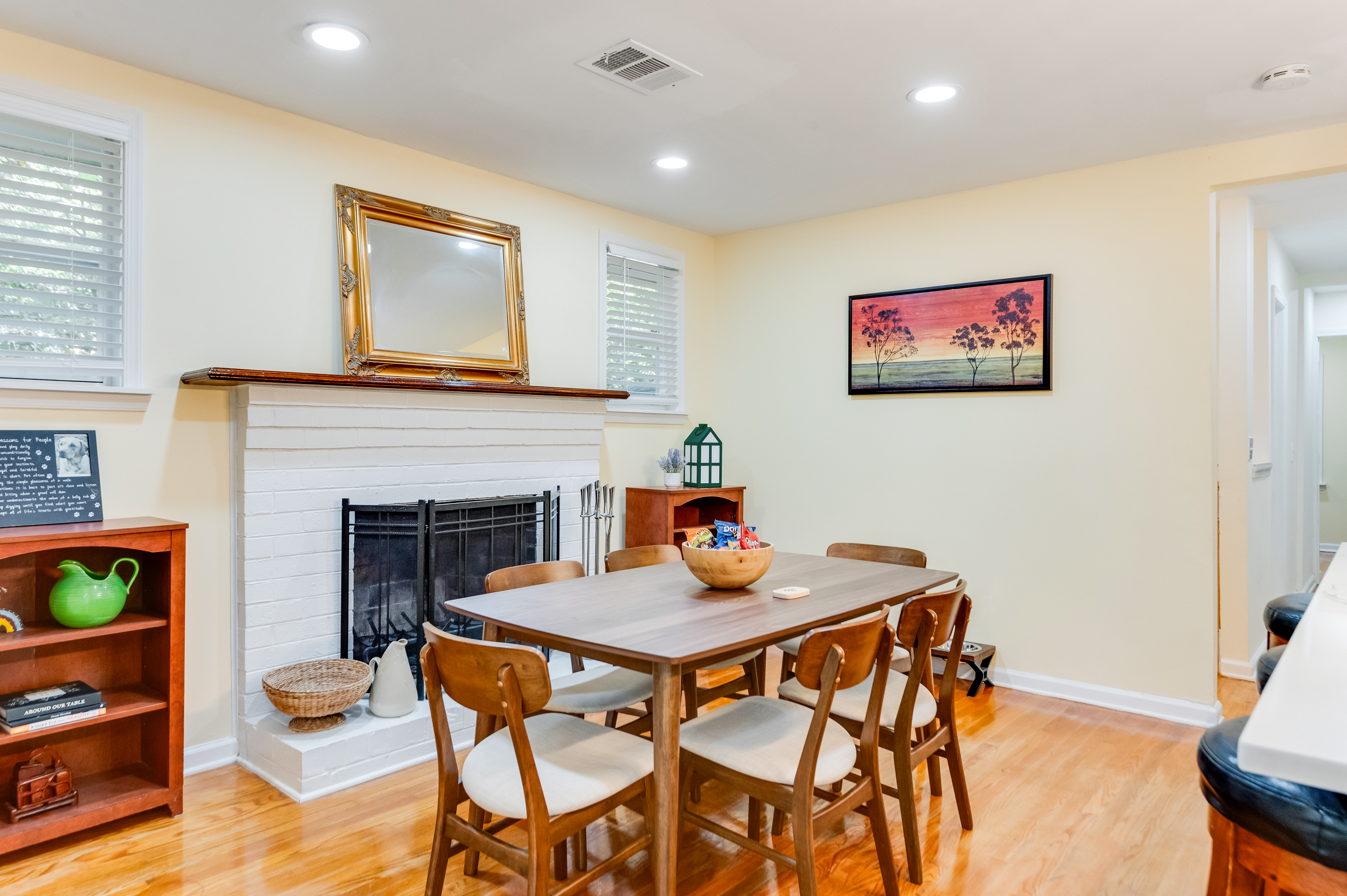 Dining Room: Gather around the stylish table and enjoy meals by the warm, inviting fireplace!