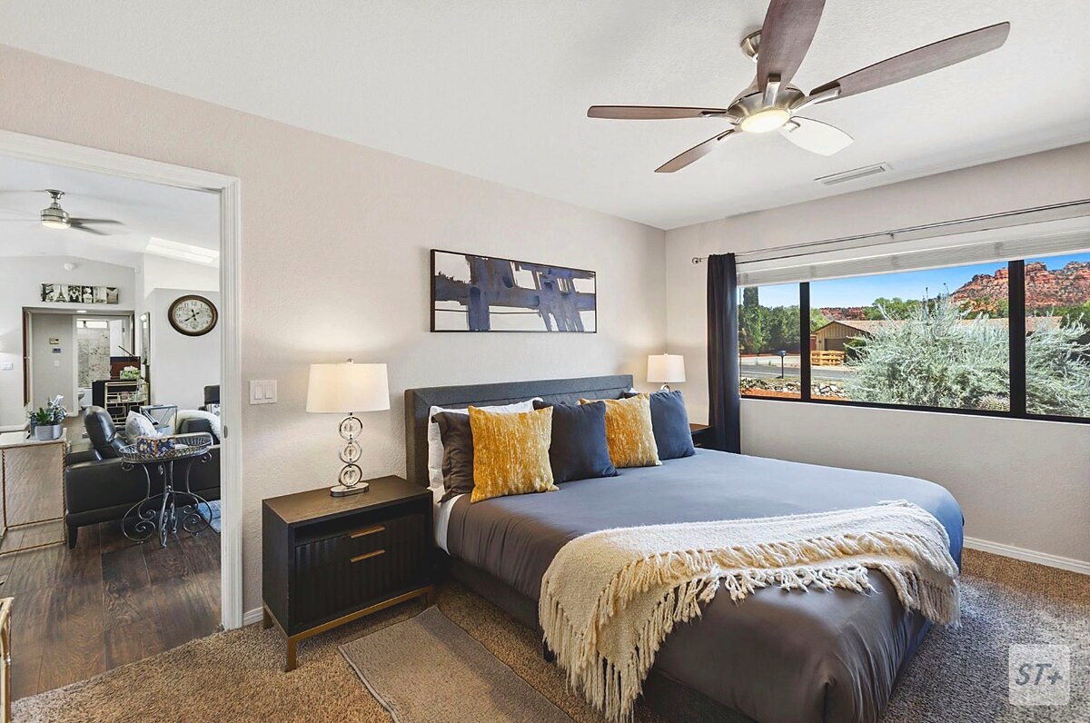 Master bedroom with king sized bed, with red rock views