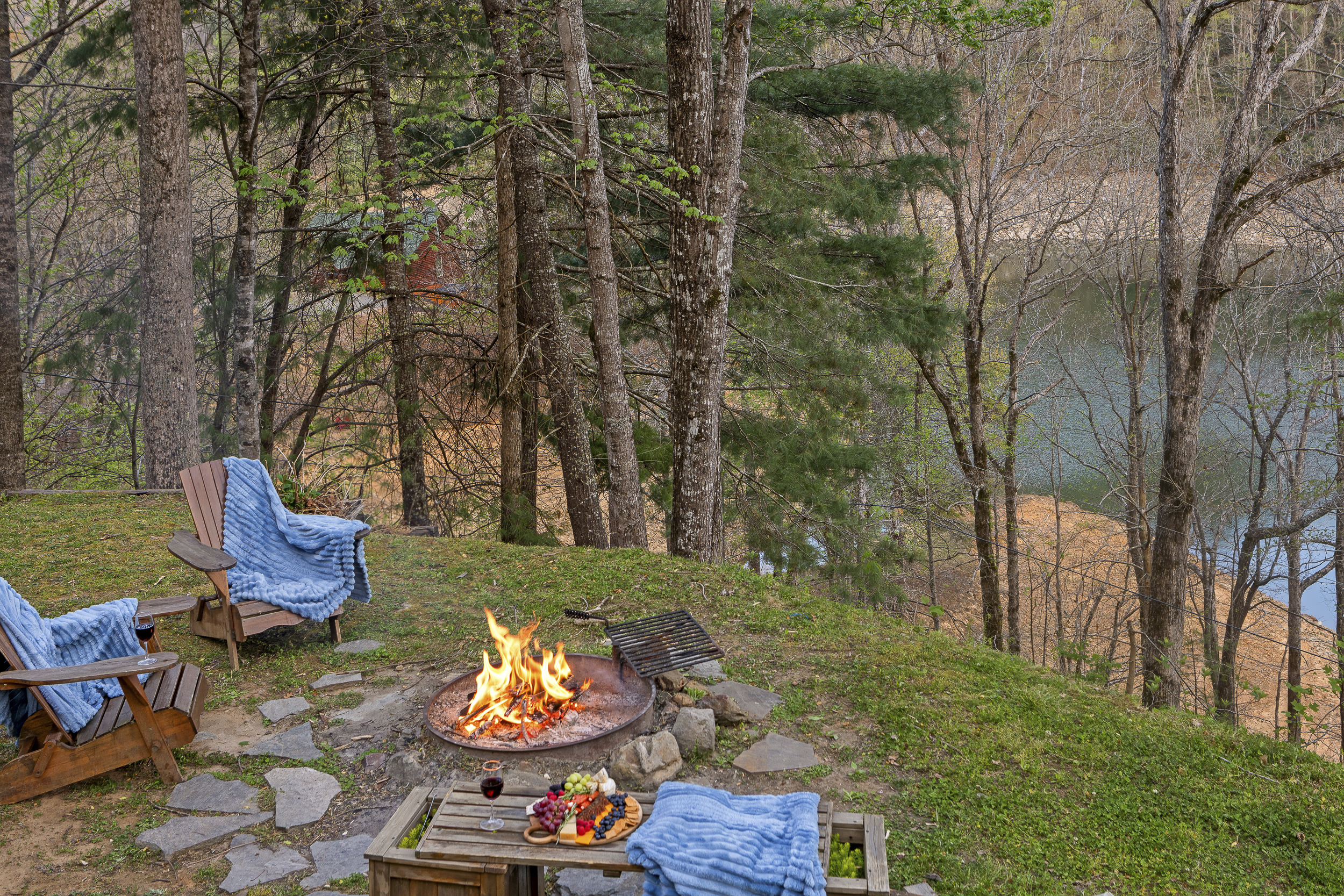 Fire Pit Retreat: Unwind by the fire with breathtaking lake views and tasty treats!