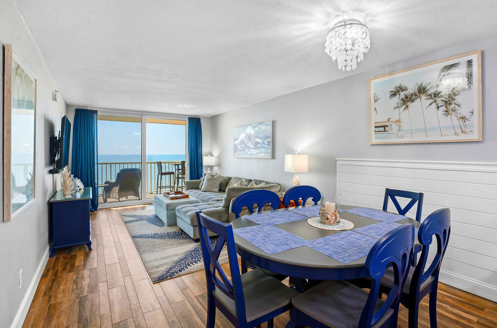 Enjoy coastal dining with ocean views, seamlessly connected to a stylish living space and private balcony for the perfect beach retreat.