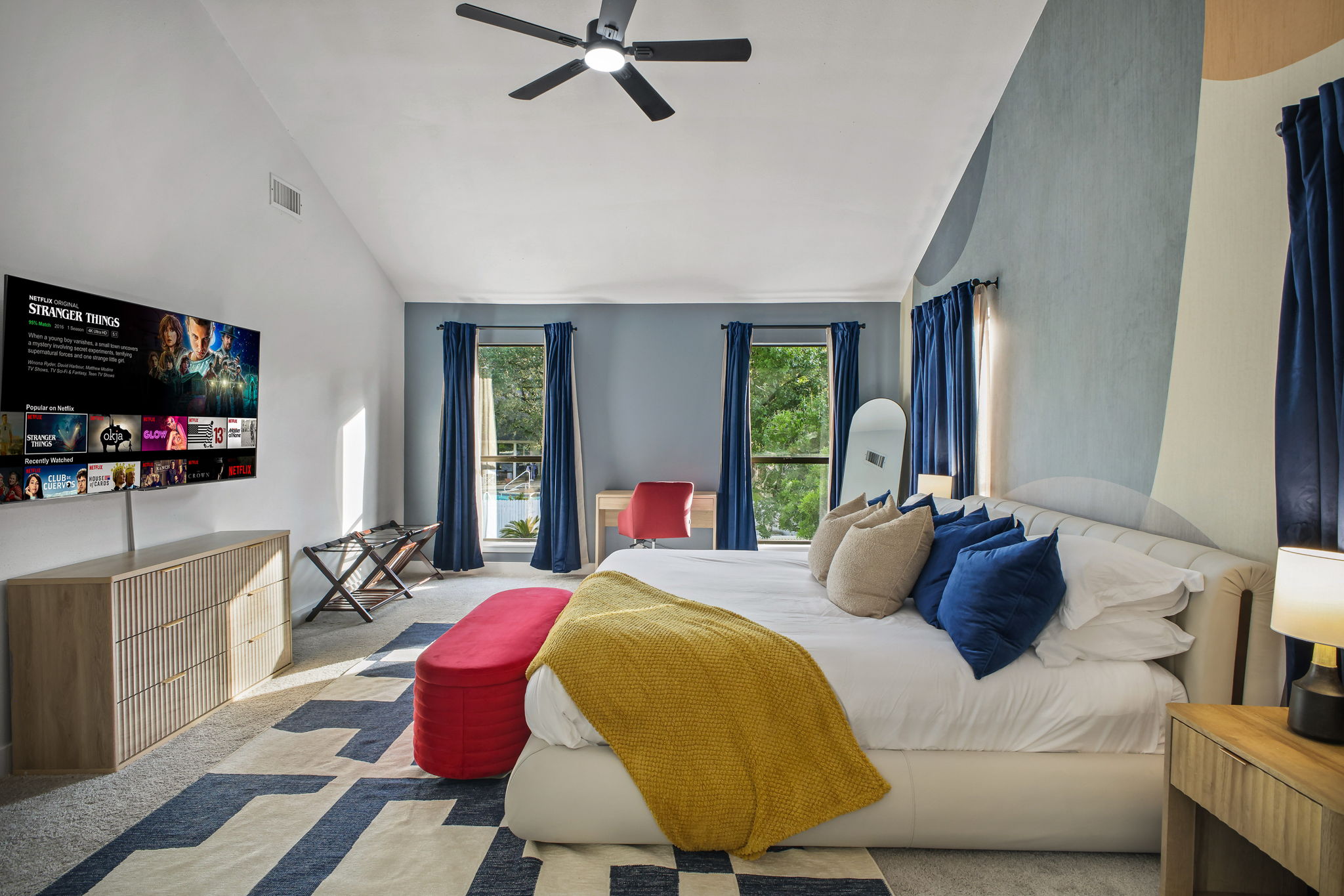 Master Bedroom: Smart TV and a dedicated desk for remote work.