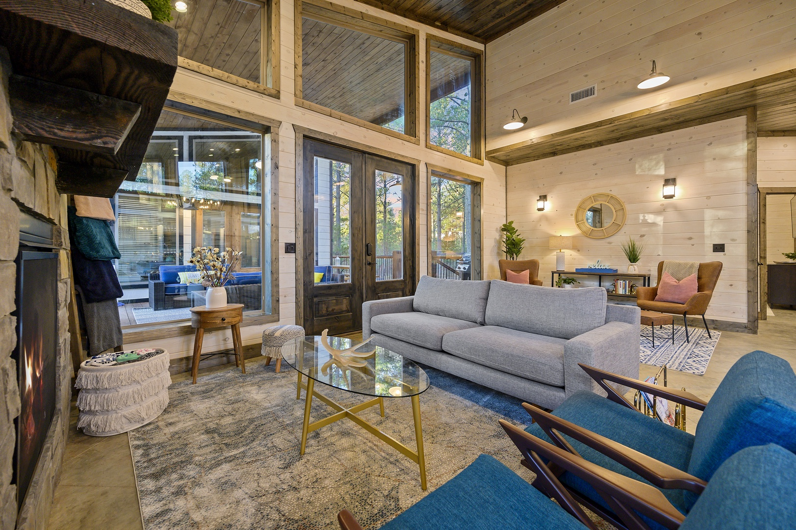 Generous ceilings and forest views give the living area an airy calm. Stretch out after a day at the lake and let the outside world slip away.