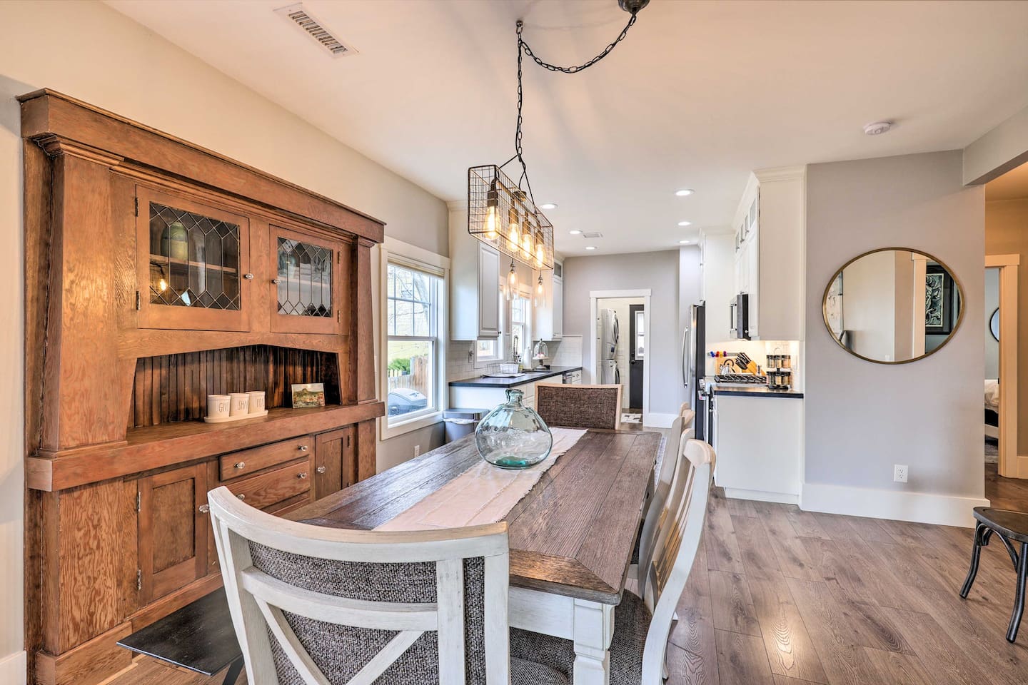 An antique hutch adds character to a dining space made for shared meals.