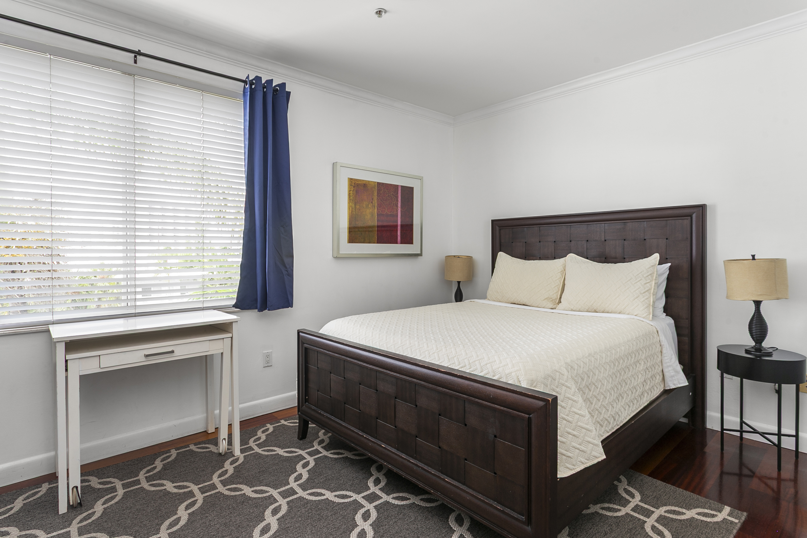 Guest Suite with en-suite bath, closet storage, and room-darkening curtains