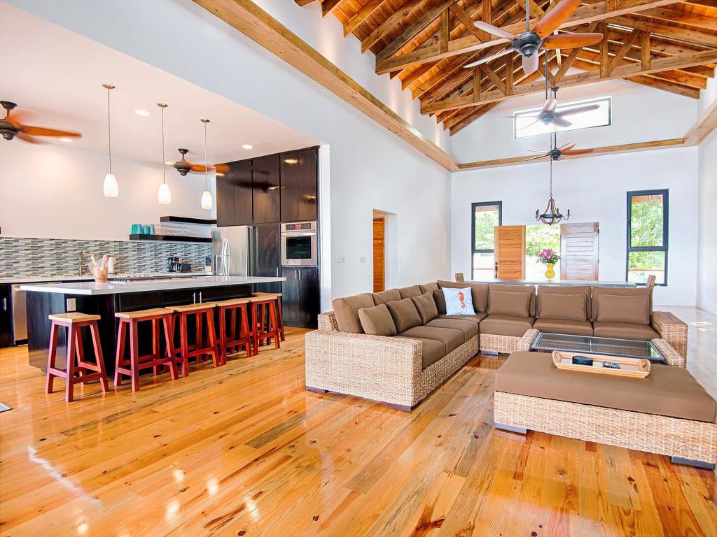 The South House great room at Vivaro is a central, open-concept space designed for both social connection and relaxation. This "modern masterpiece" focuses on a seamless indoor-outdoor lifestyle, specifically designed for groups to be "together but apart".