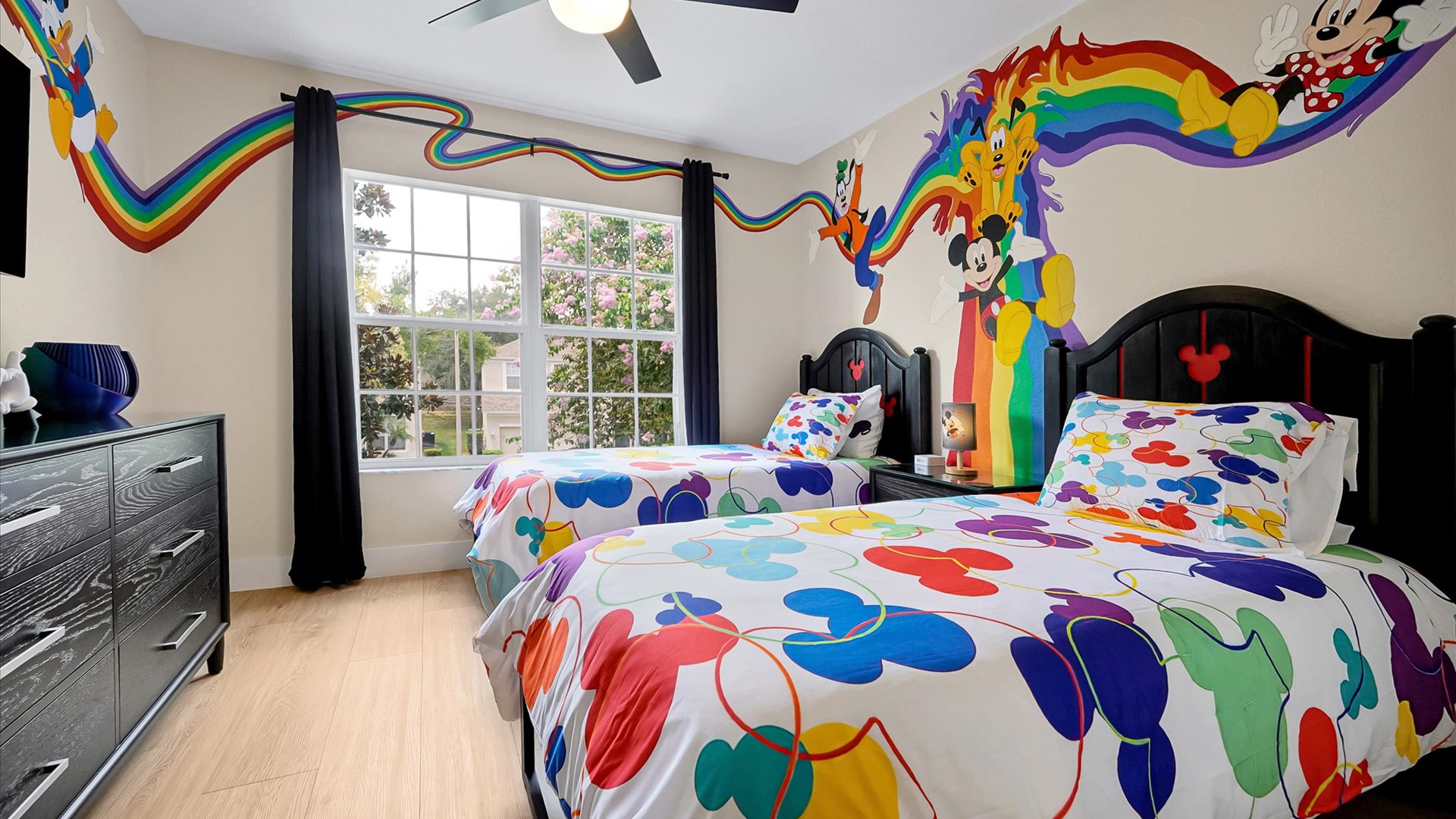 Mickey’s Rainbow Magic – Two twin beds, closet storage and TV