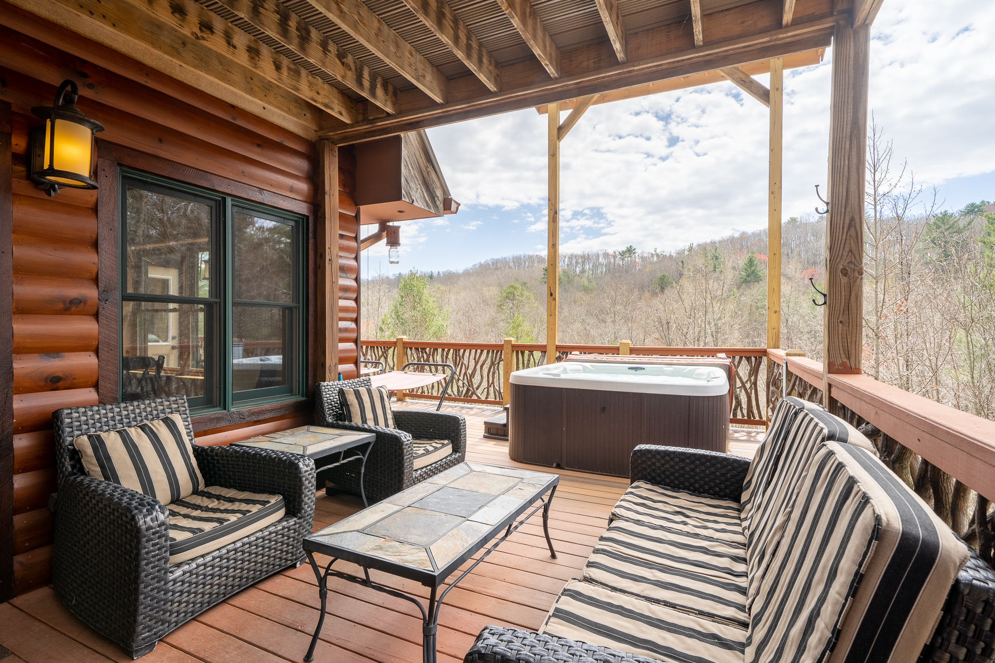 Outdoor sitting area under covered deck.