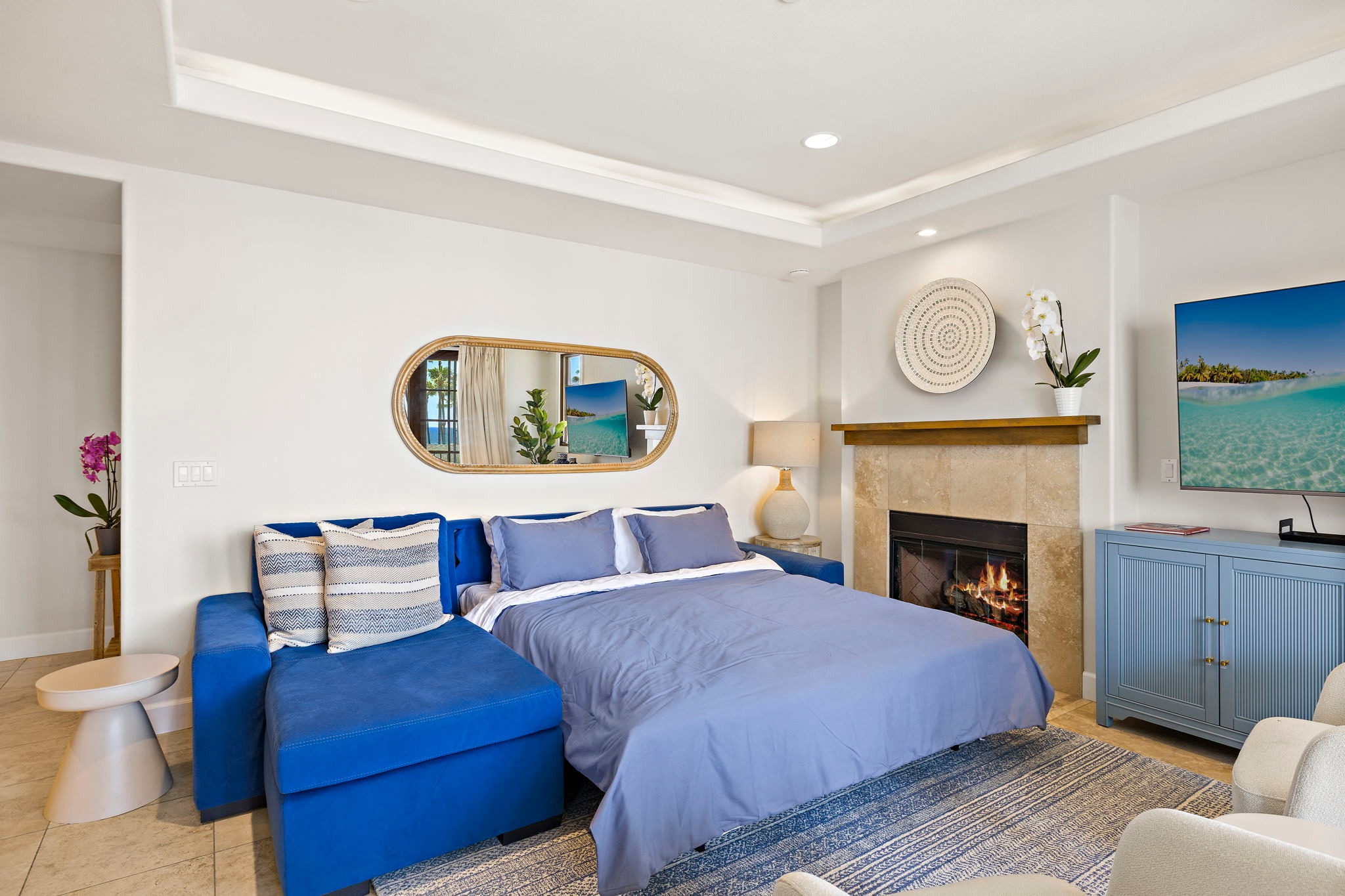 Here is the queen-sized sofa bed extended and setup for sleeping.  Some people prefer sleeping out here so they can hear waves at night.