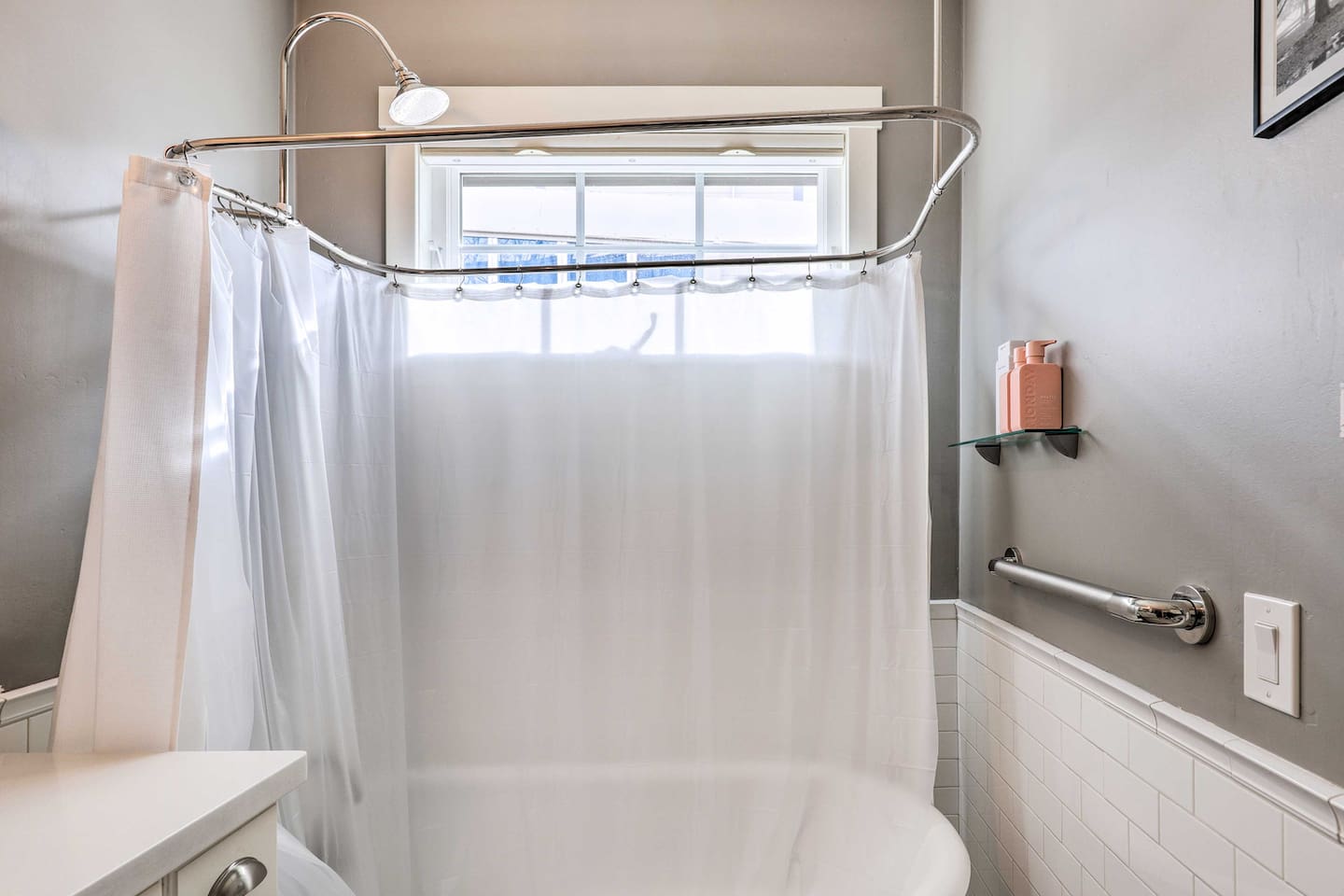Sink into a long soak under natural light streaming through the window.