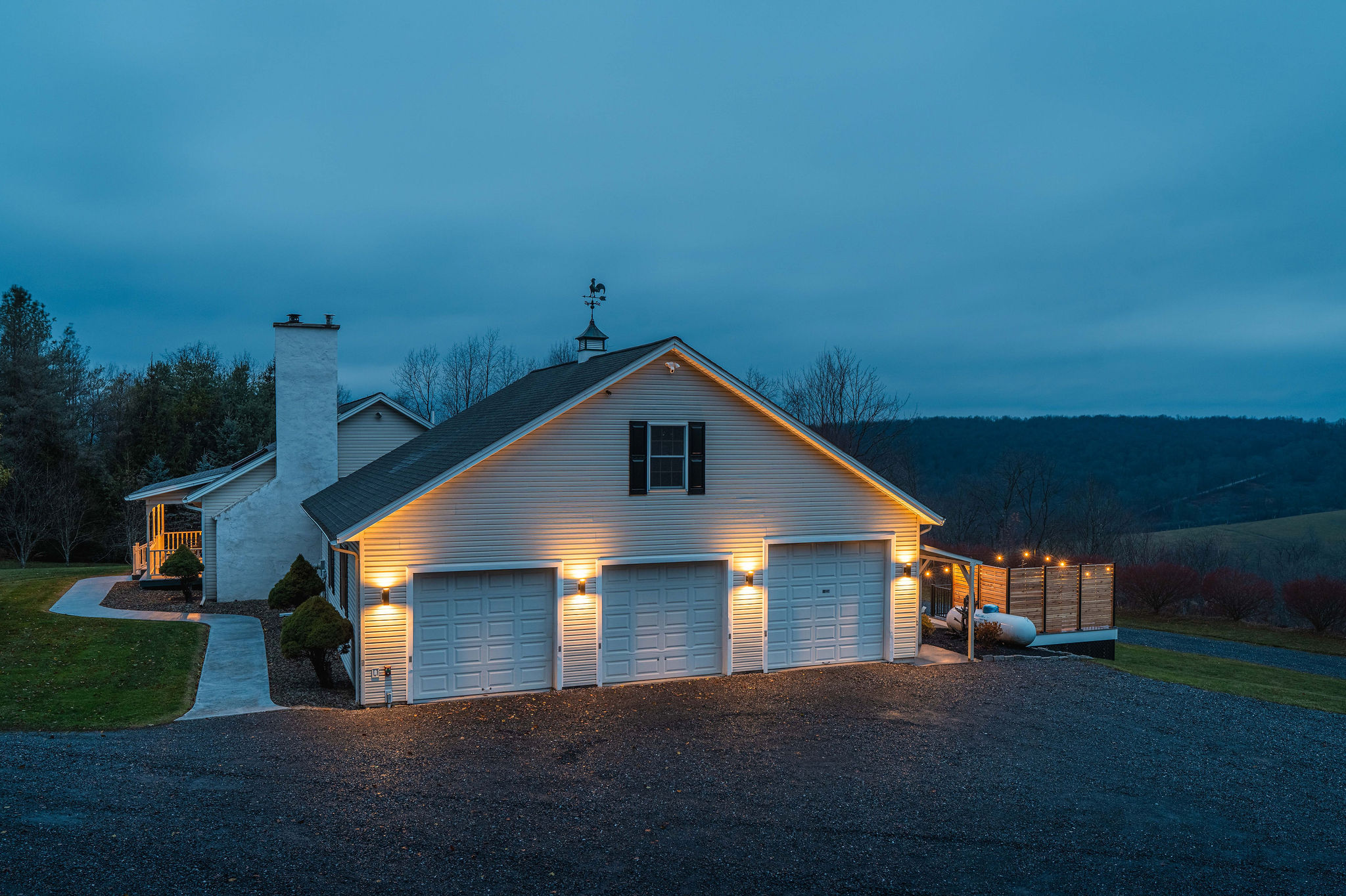 Spacious 3-car garage and ample parking with scenic mountain backdrop