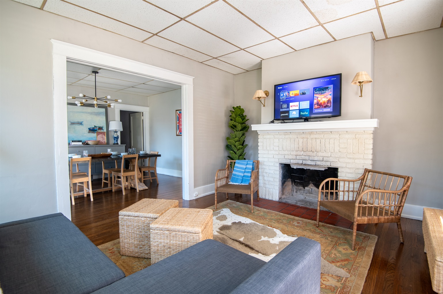 Cozy living area with smart TV and vibrant art pieces.